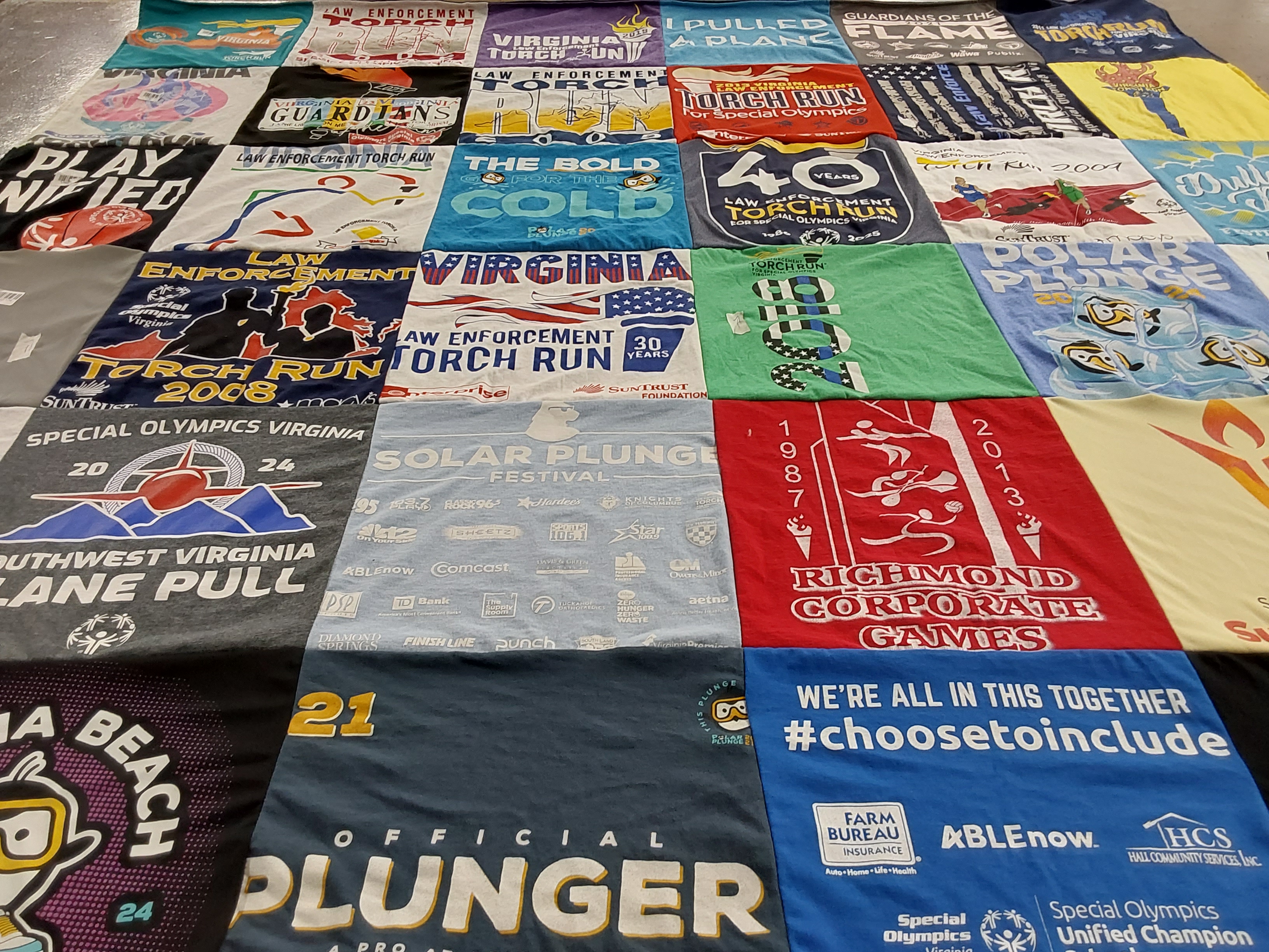 T-shirt quilt with sports, community themes by Holly from VA