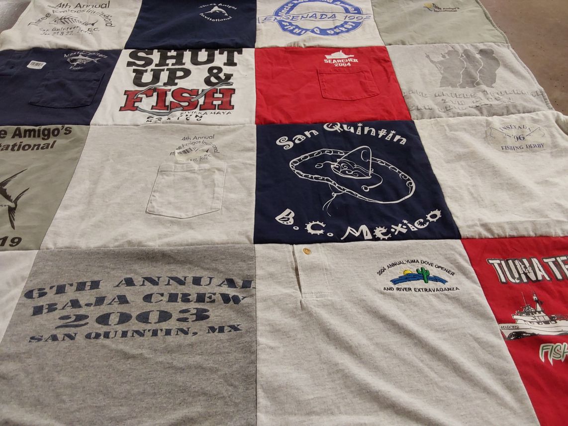 T-shirt quilt with fishing, dove hunting themes by Sheri from AZ