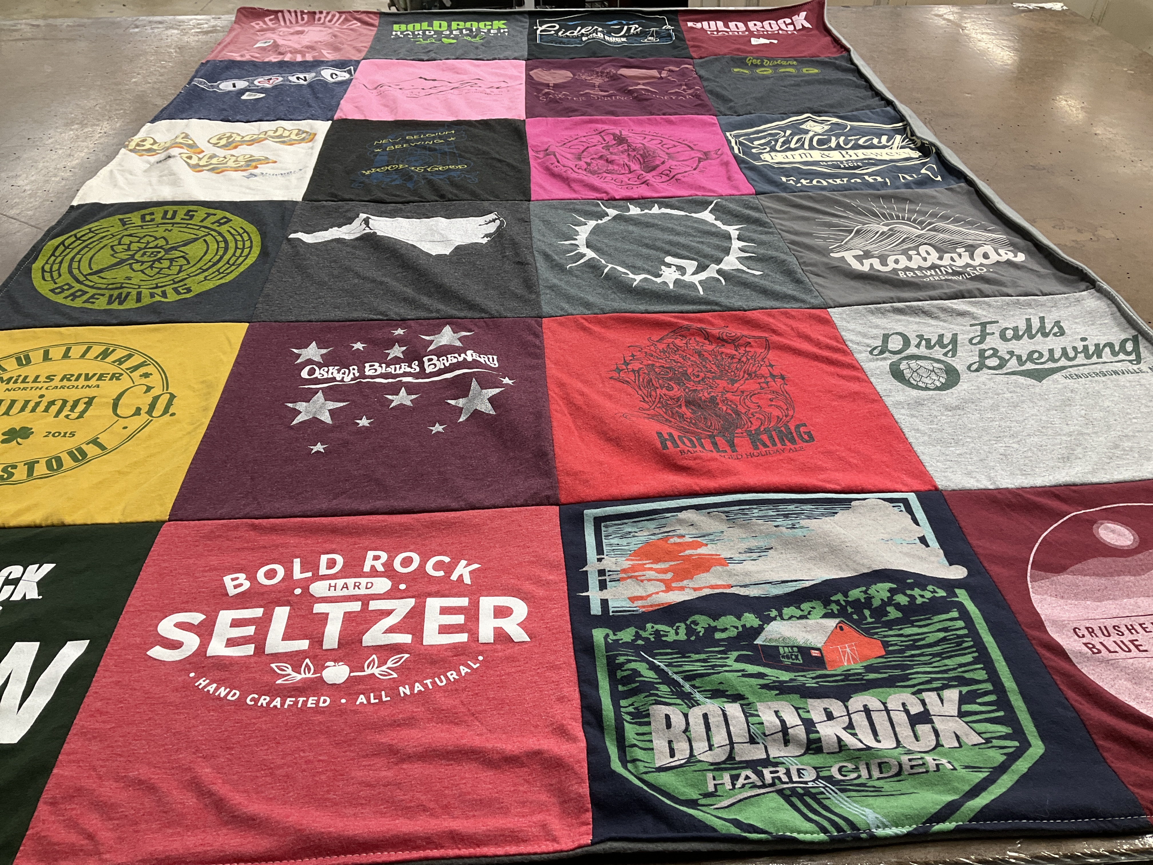 T-shirt quilt with brewing, seltzer themes by Carol from NC