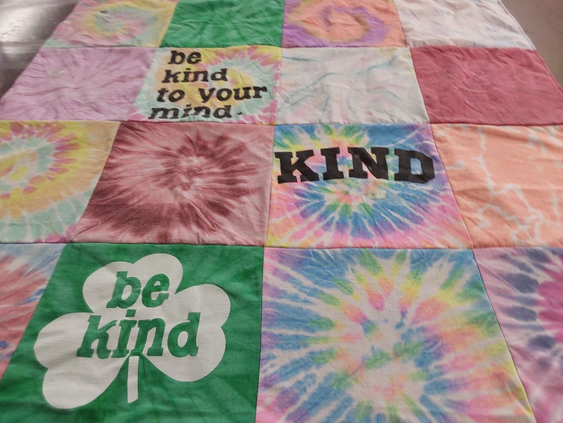 T-shirt quilt with kindness, mental health themes by Joan from FL