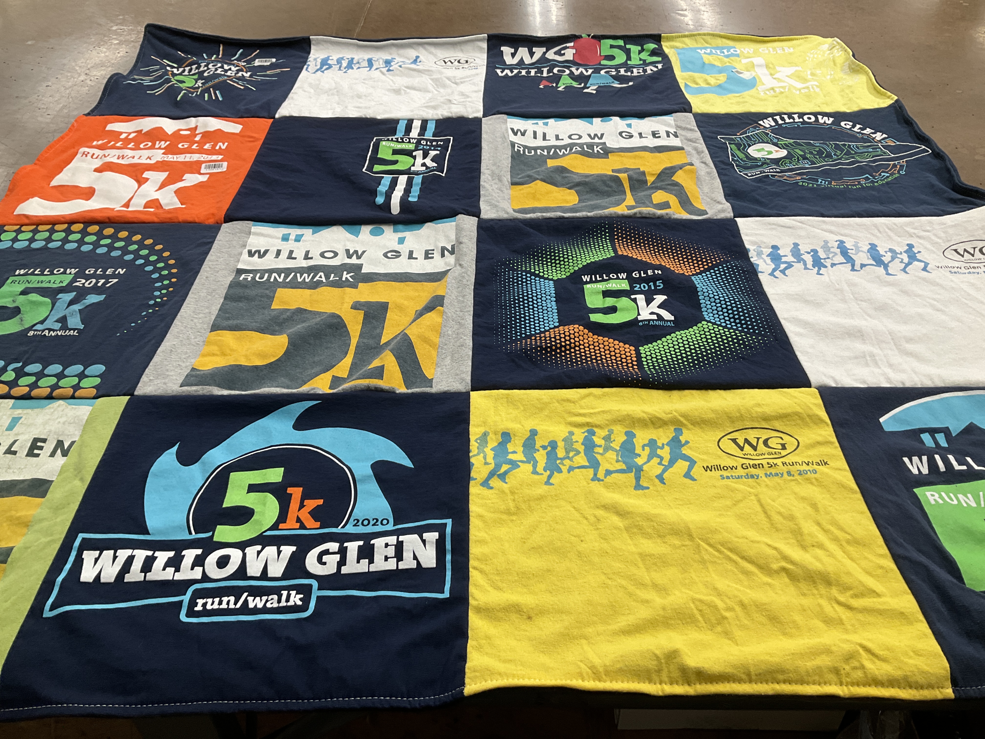 T-shirt quilt with running, community events themes by Elisa from CA