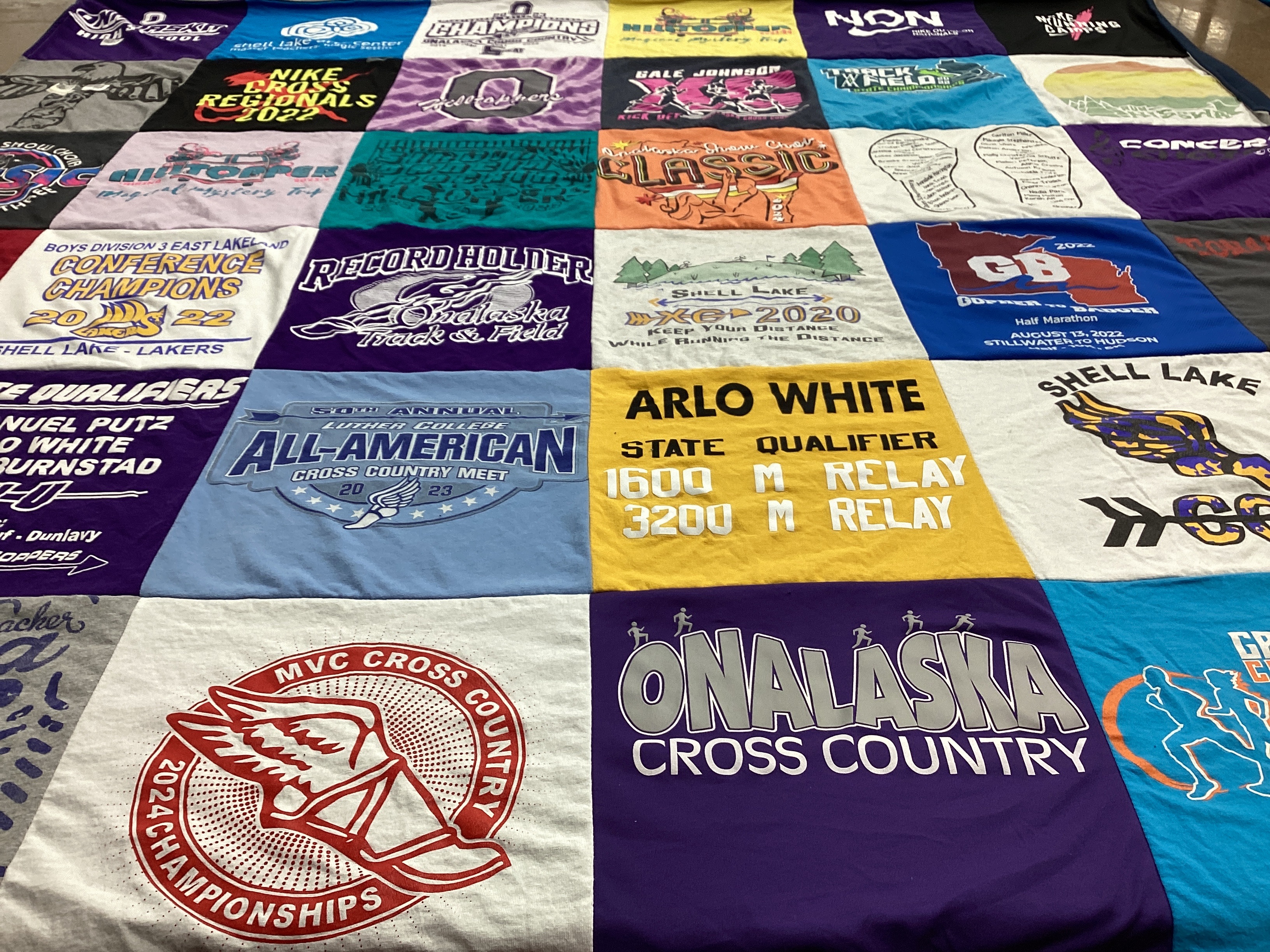 T-shirt quilt featuring onalaska cross country by Liv from WI