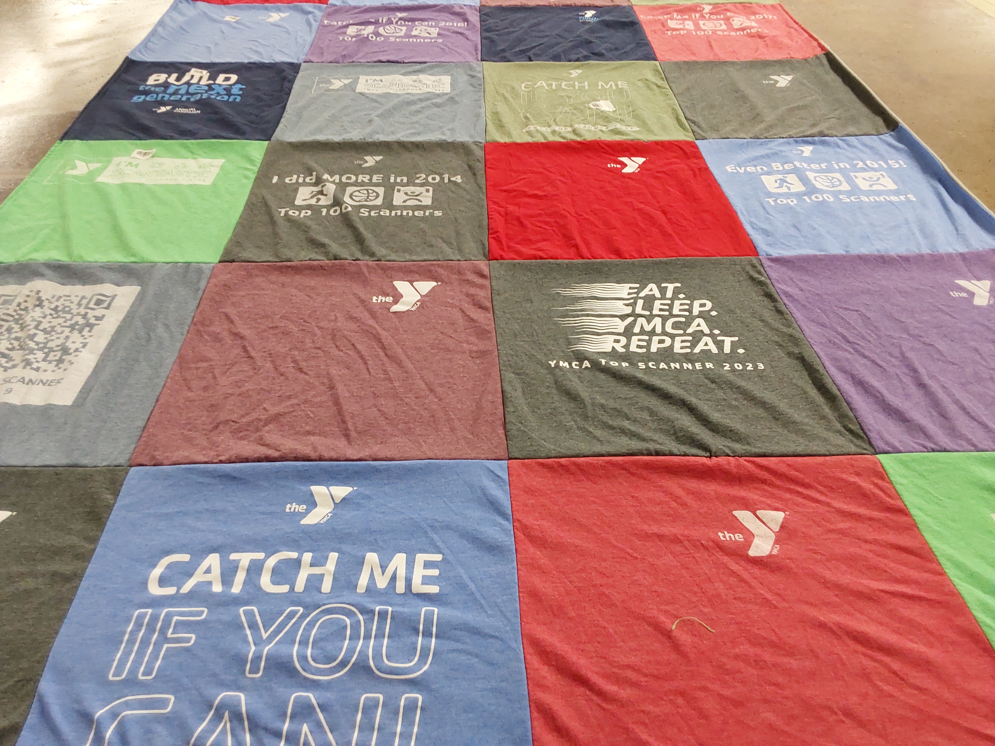 T-shirt quilt with fitness, community service themes by Linda from NC