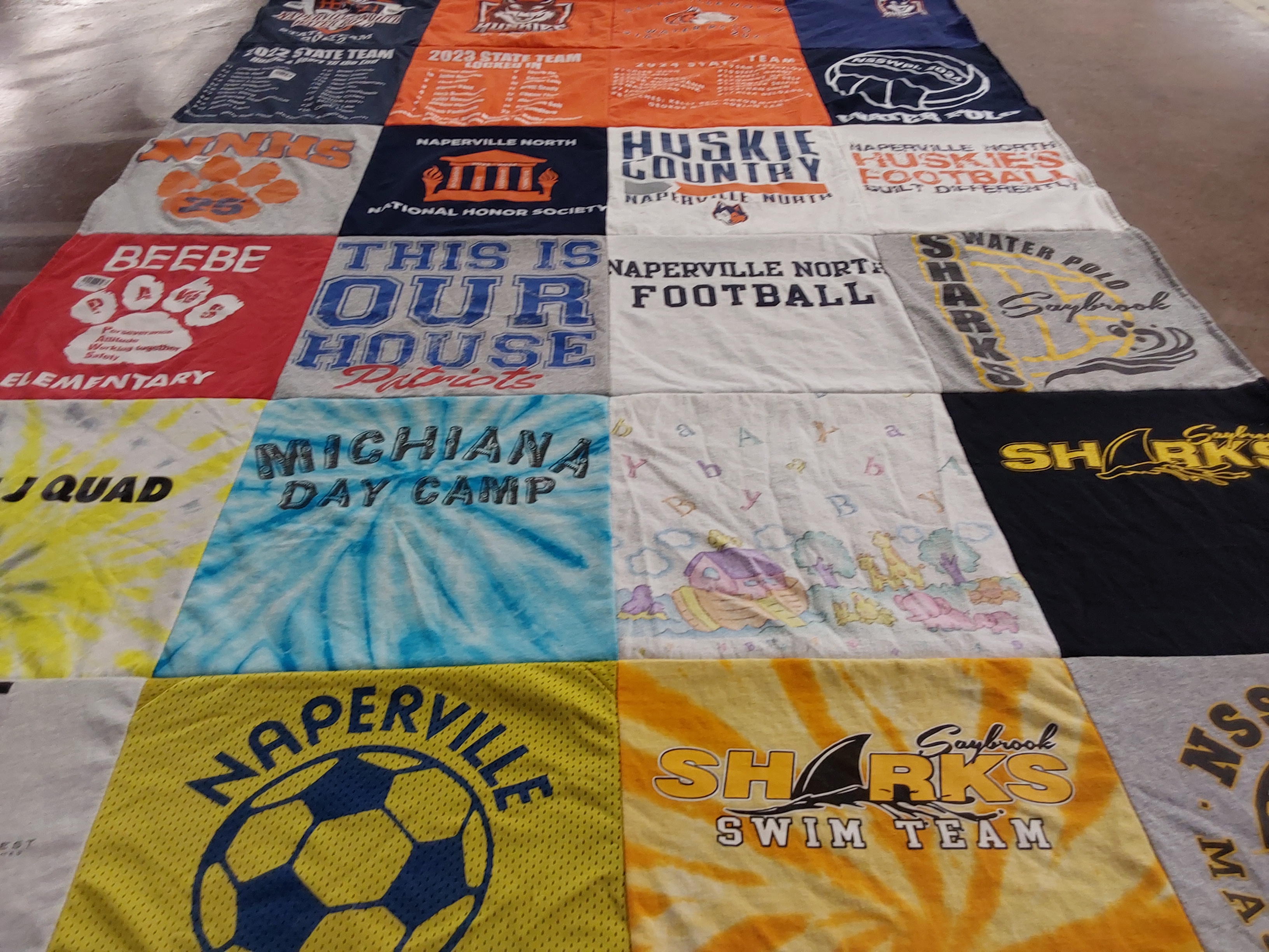 T-shirt quilt featuring naperville north huskies football, saybrook sharks swim team by Jennifer from IL