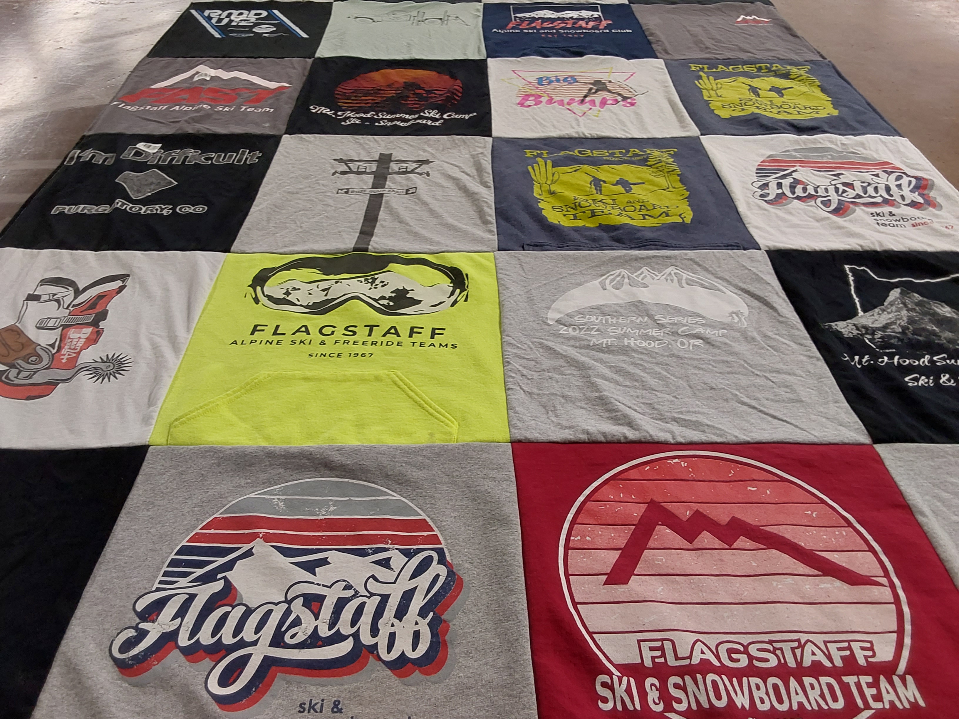 T-shirt quilt with skiing, snowboarding themes by Kelly from AZ