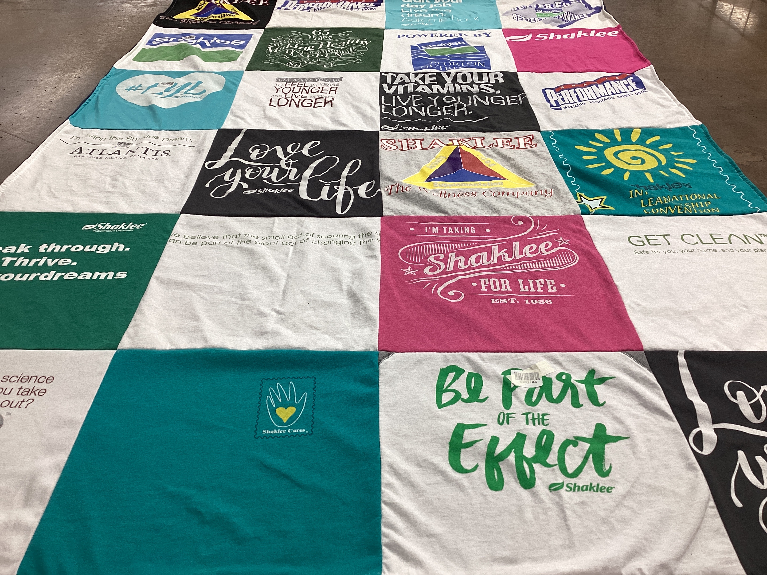 T-shirt quilt with health, wellness themes by Mary from CO