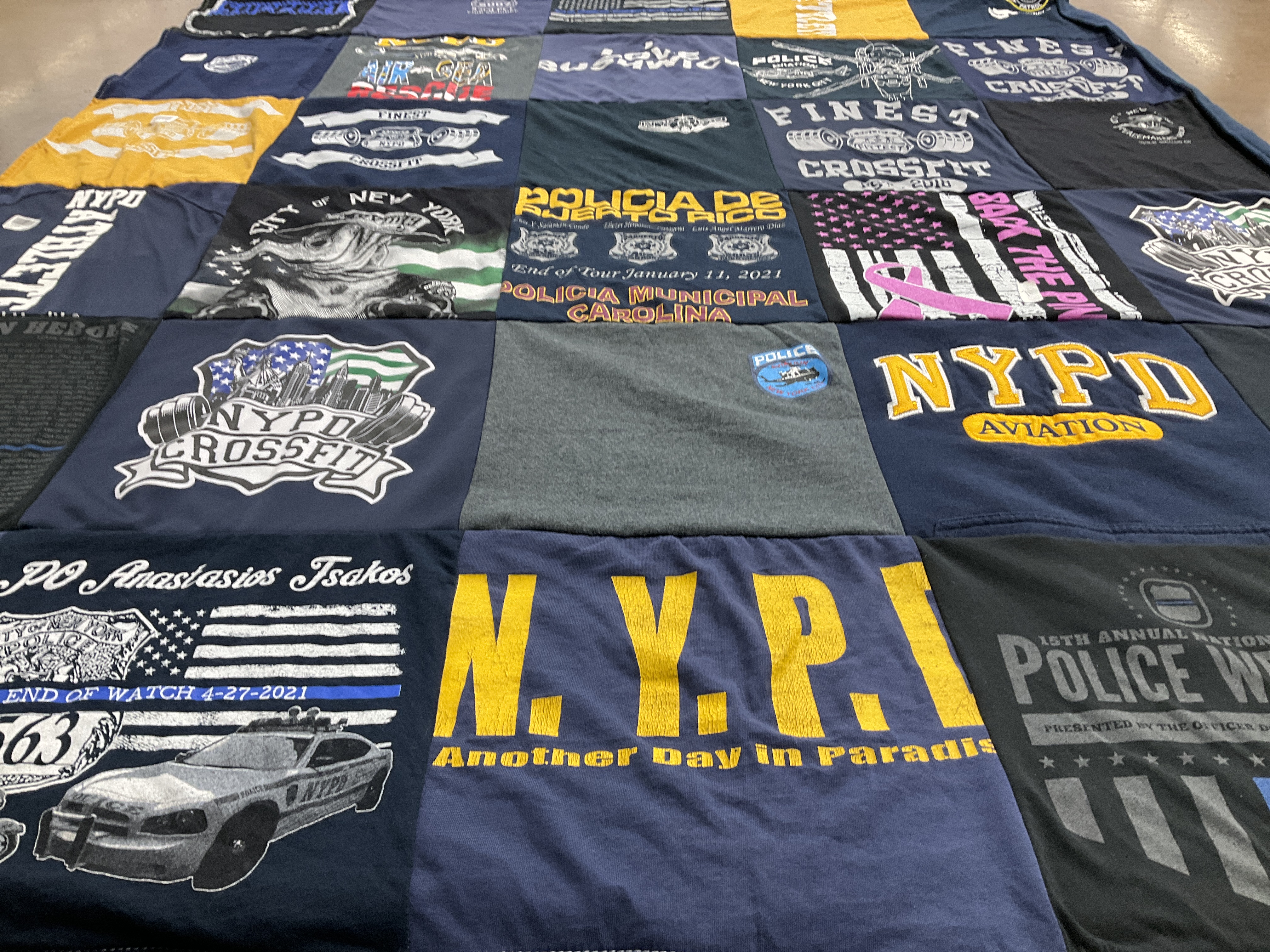 T-shirt quilt with fitness, law enforcement themes by Jessica from NY