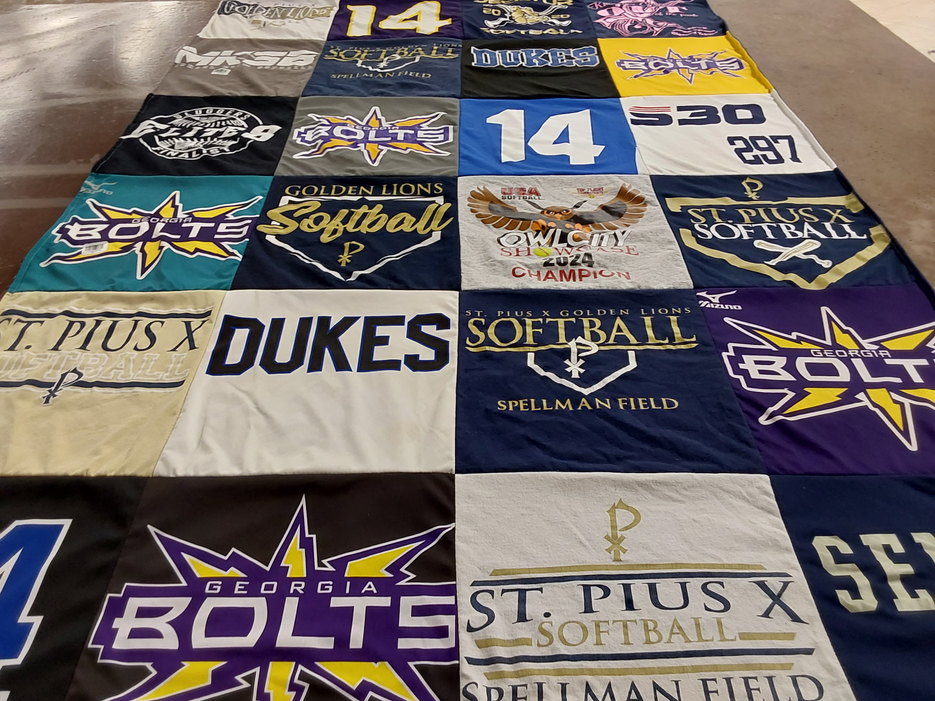 T-shirt quilt featuring georgia bolts, golden lions softball by nancy from GA
