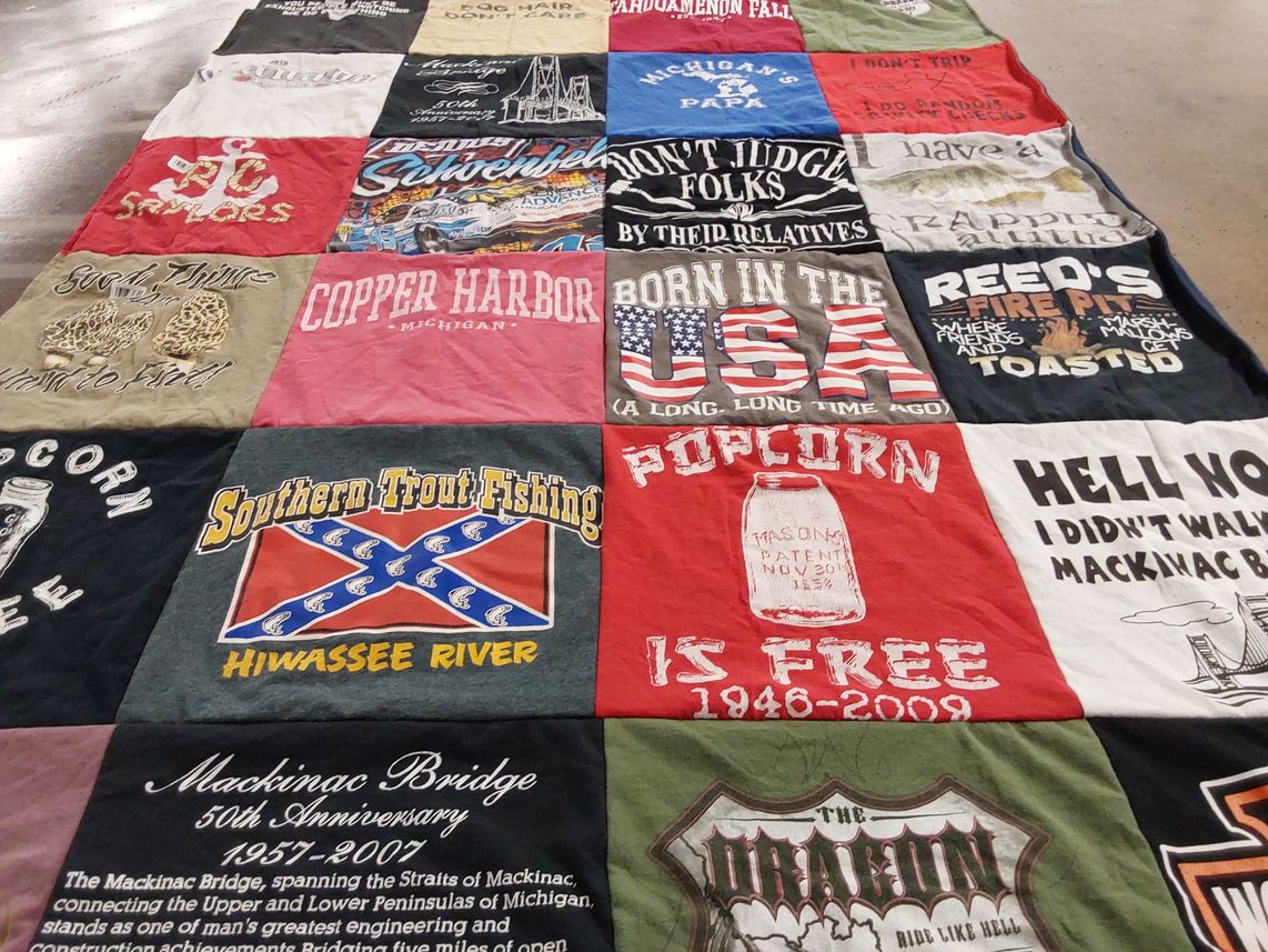 T-shirt quilt with fishing, travel themes by Christine from MI