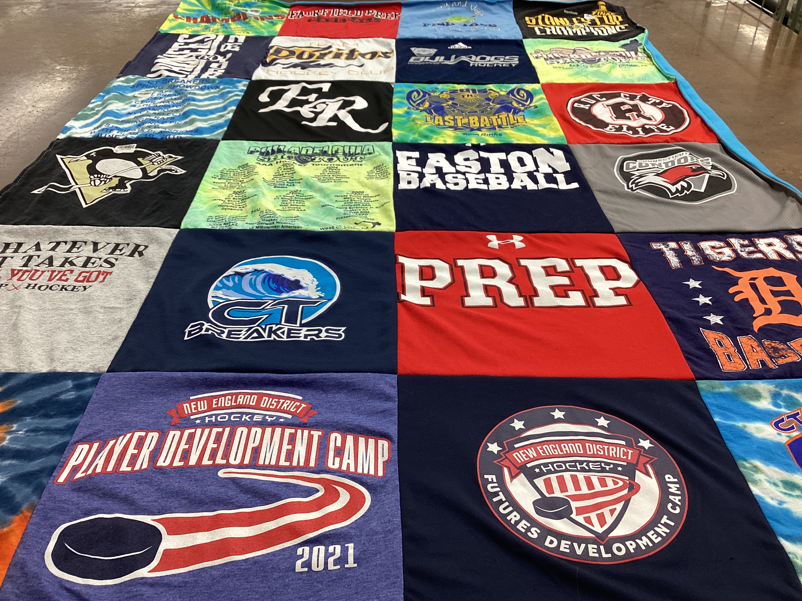T-shirt quilt with hockey, baseball themes by Marcie  from CT