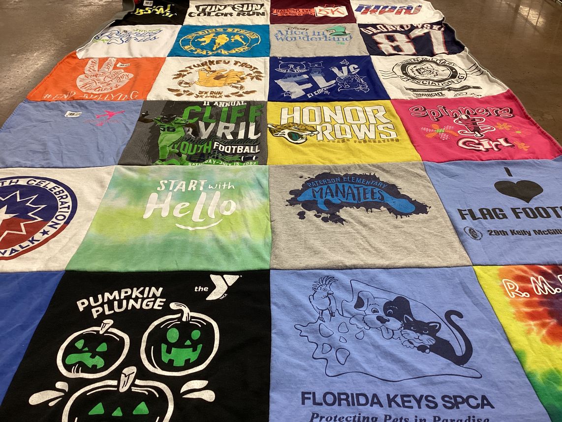 T-shirt quilt with sports, running themes by Dara from FL