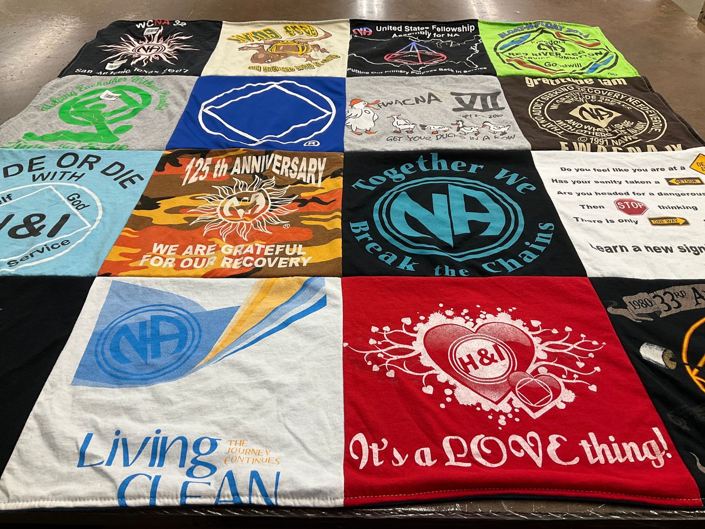 T-shirt quilt with addiction recovery, community support themes by Cherie from TX