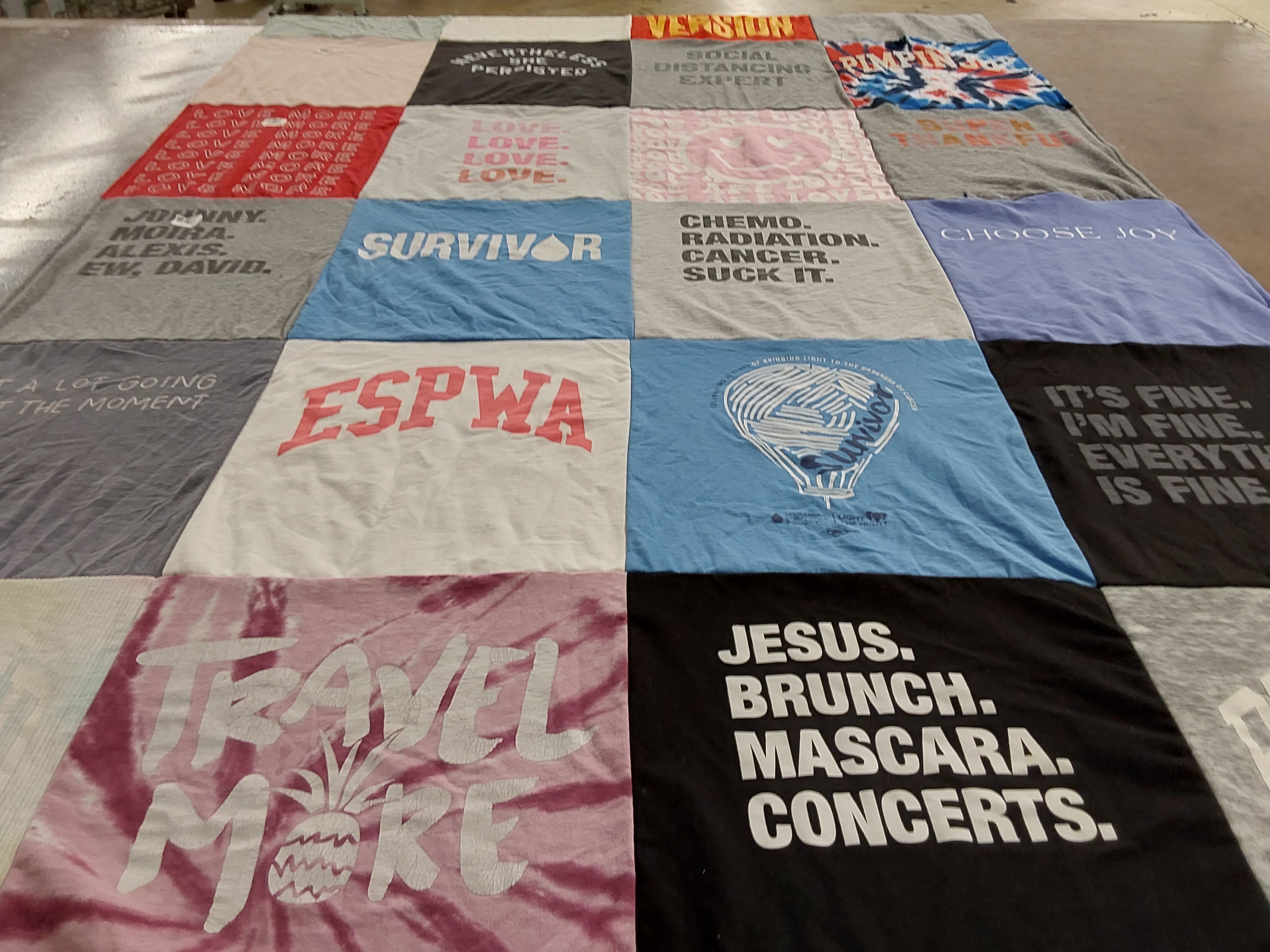 T-shirt quilt with travel, cancer awareness themes by Cameron from SC