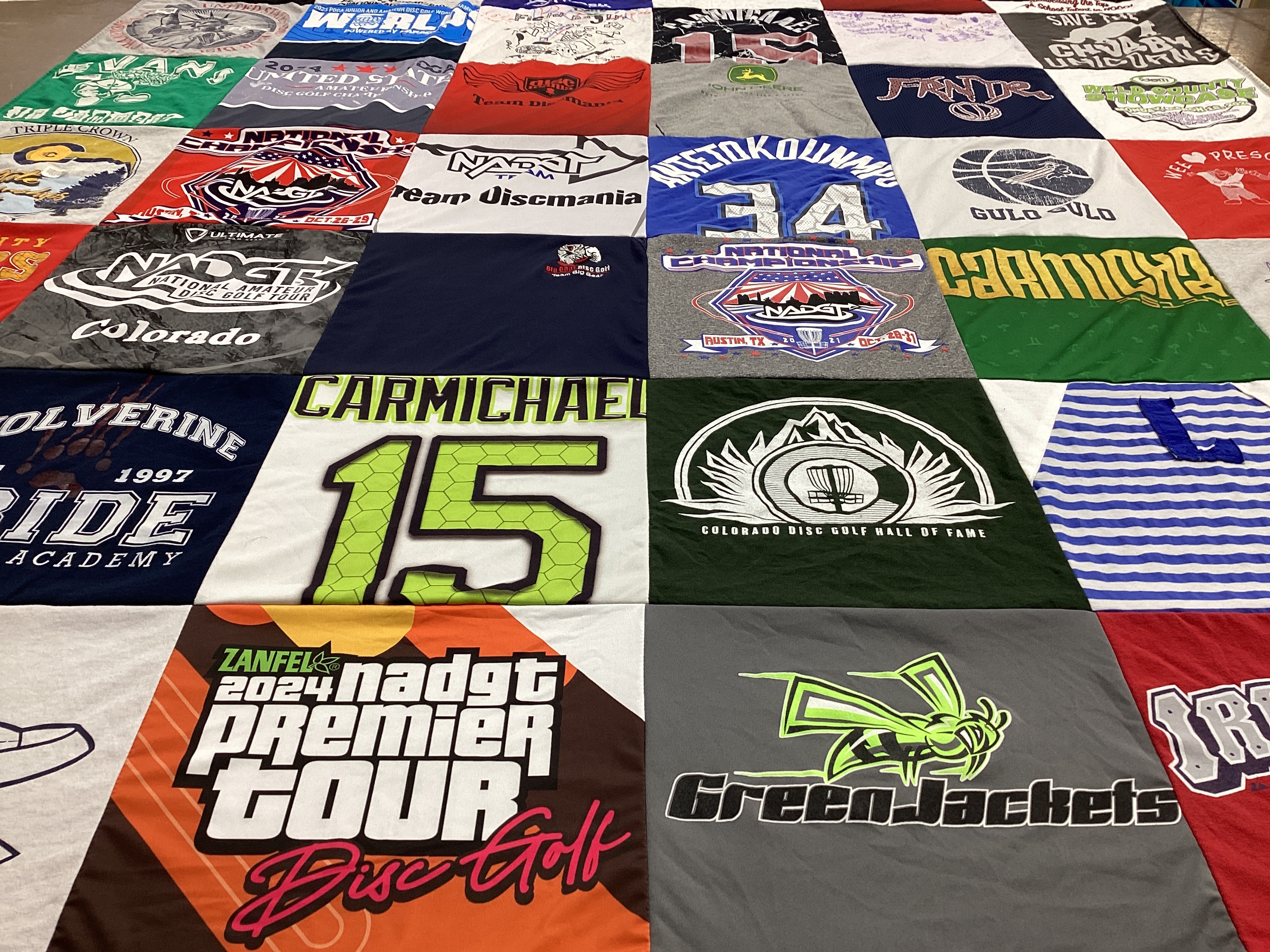 T-shirt quilt featuring green jackets by Shari from CO
