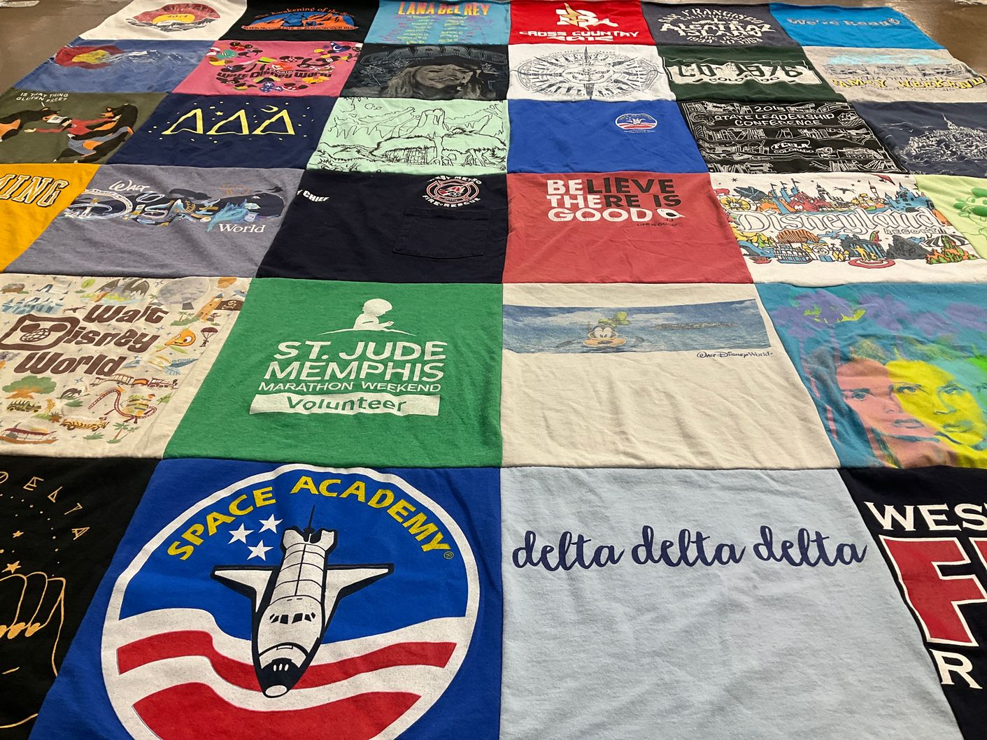 T-shirt quilt with disney, volunteering themes by Mary from CO