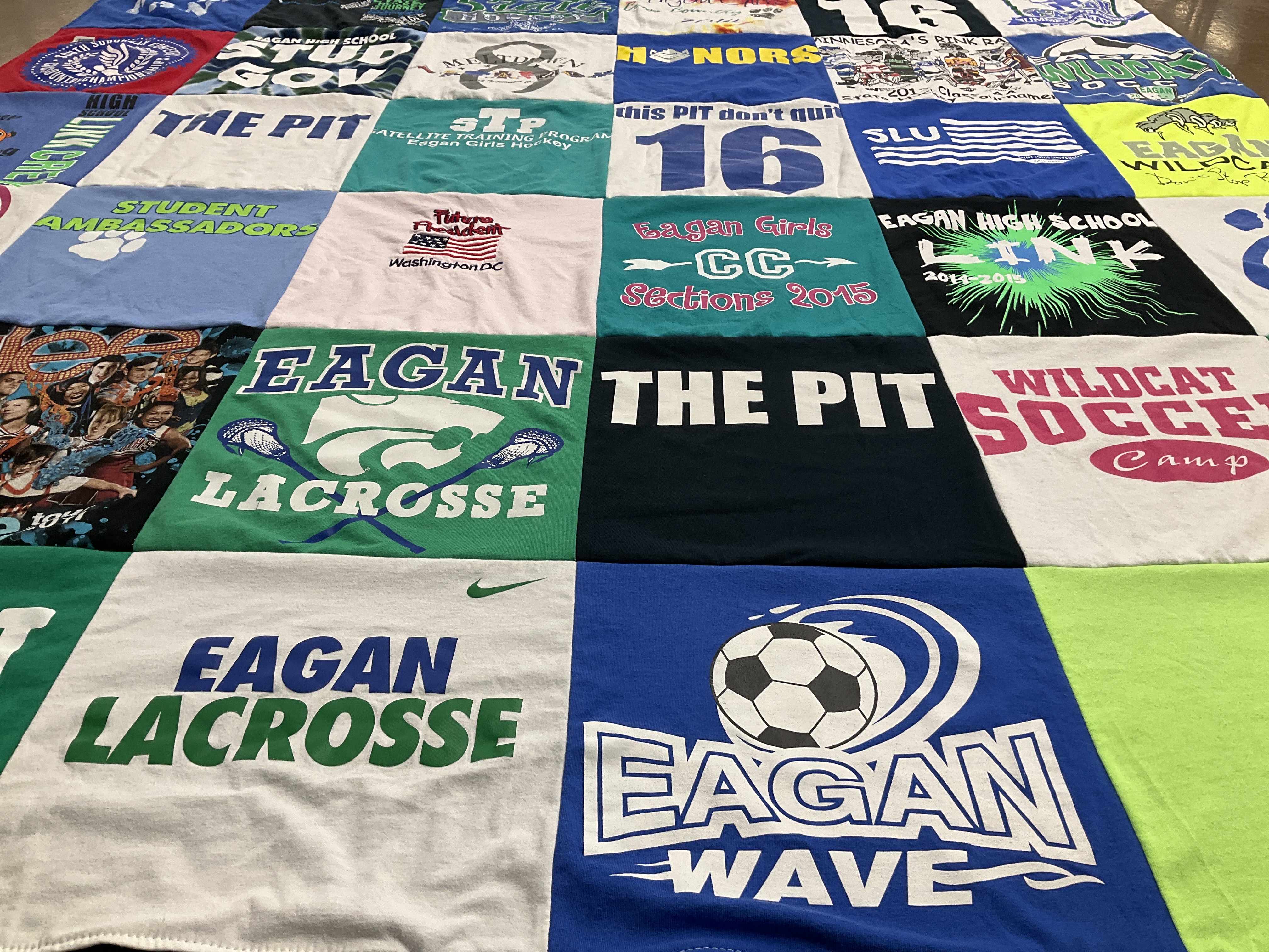 T-shirt quilt featuring eagan lacrosse, eagan wildcat soccer by Annie from MN