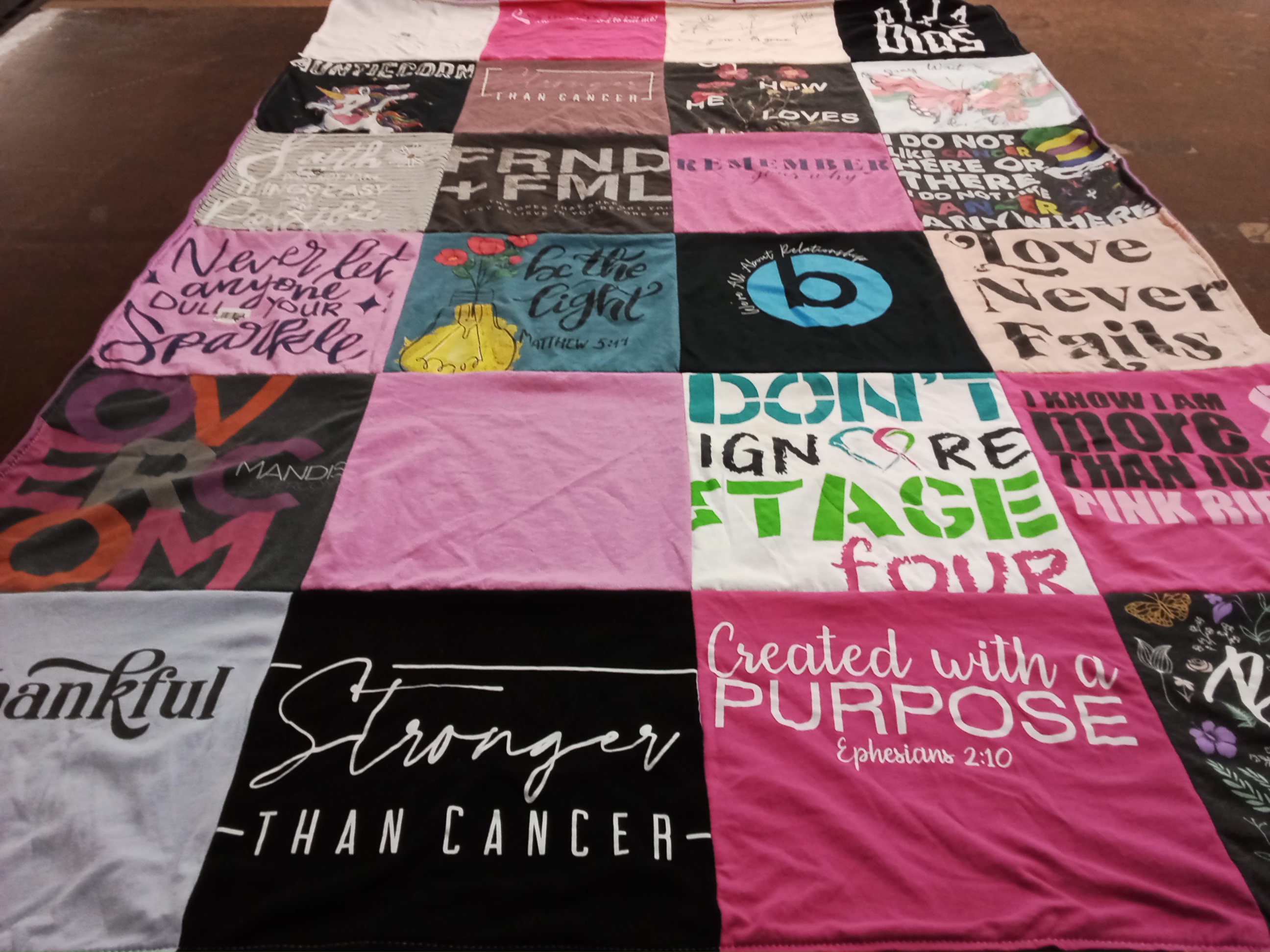 T-shirt quilt with supporting cancer awareness, faith themes by Sandra from AZ