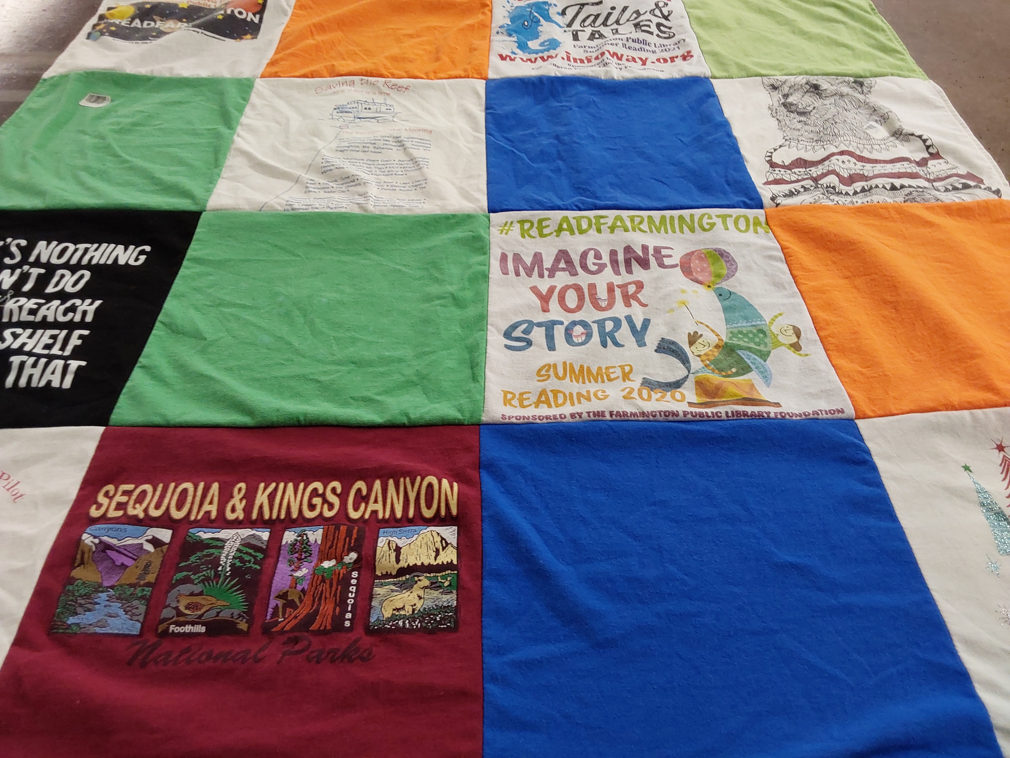 T-shirt quilt with reading, parks themes by Paula from CO