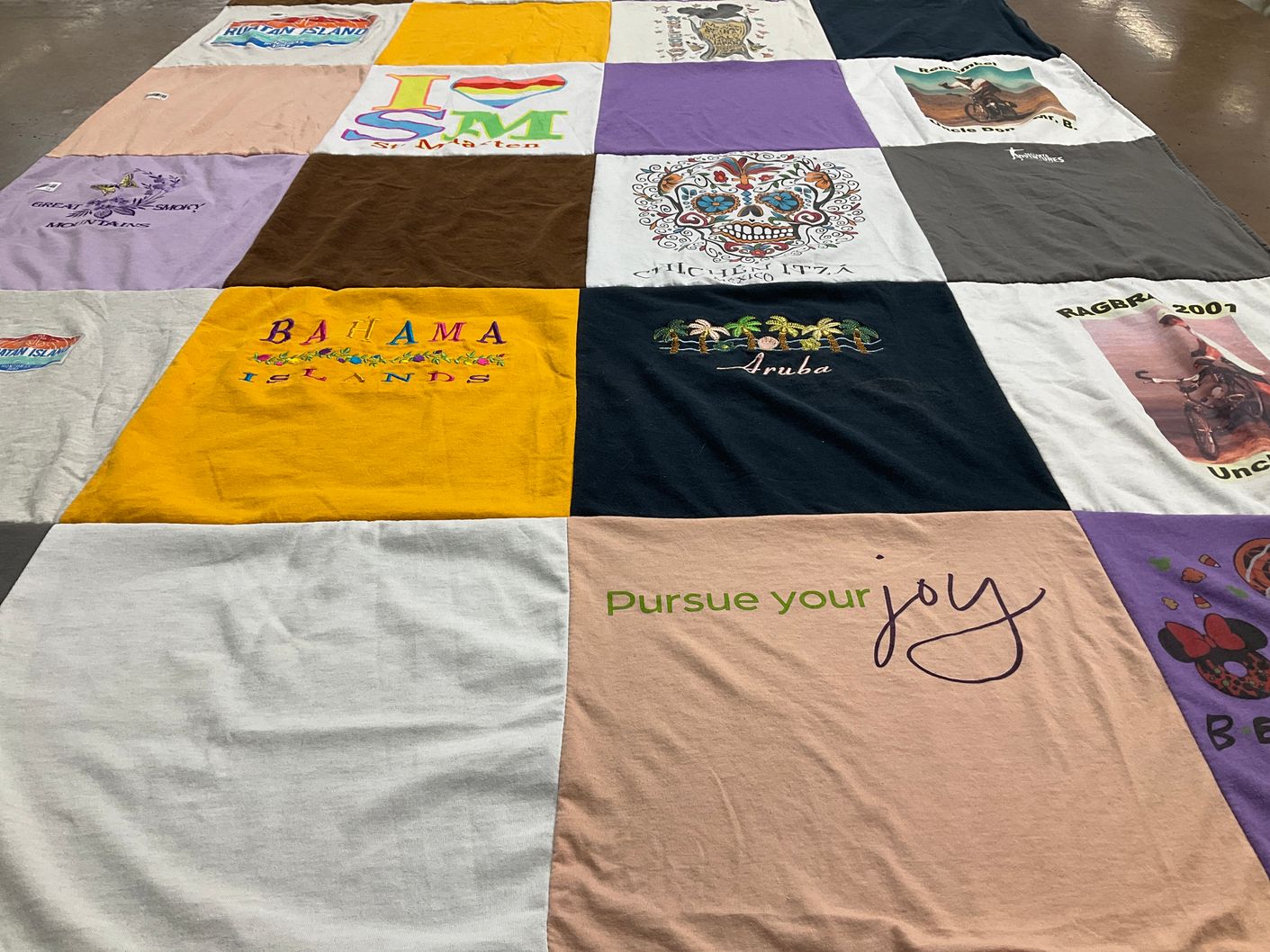 T-shirt quilt with travel, happiness themes by Wendy from IA
