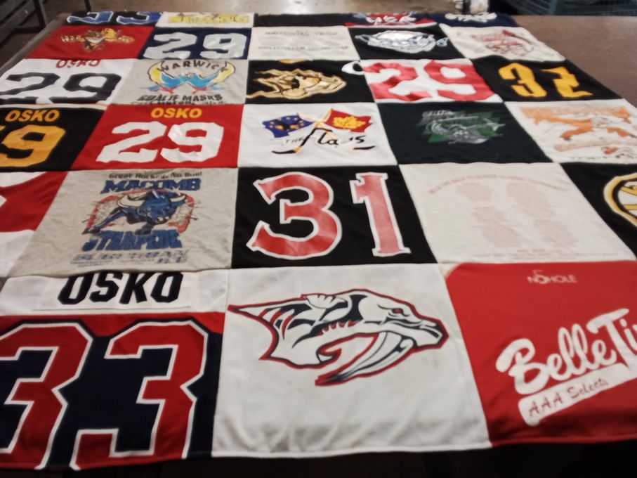 T-shirt quilt with hockey, sports themes by Ann from MI