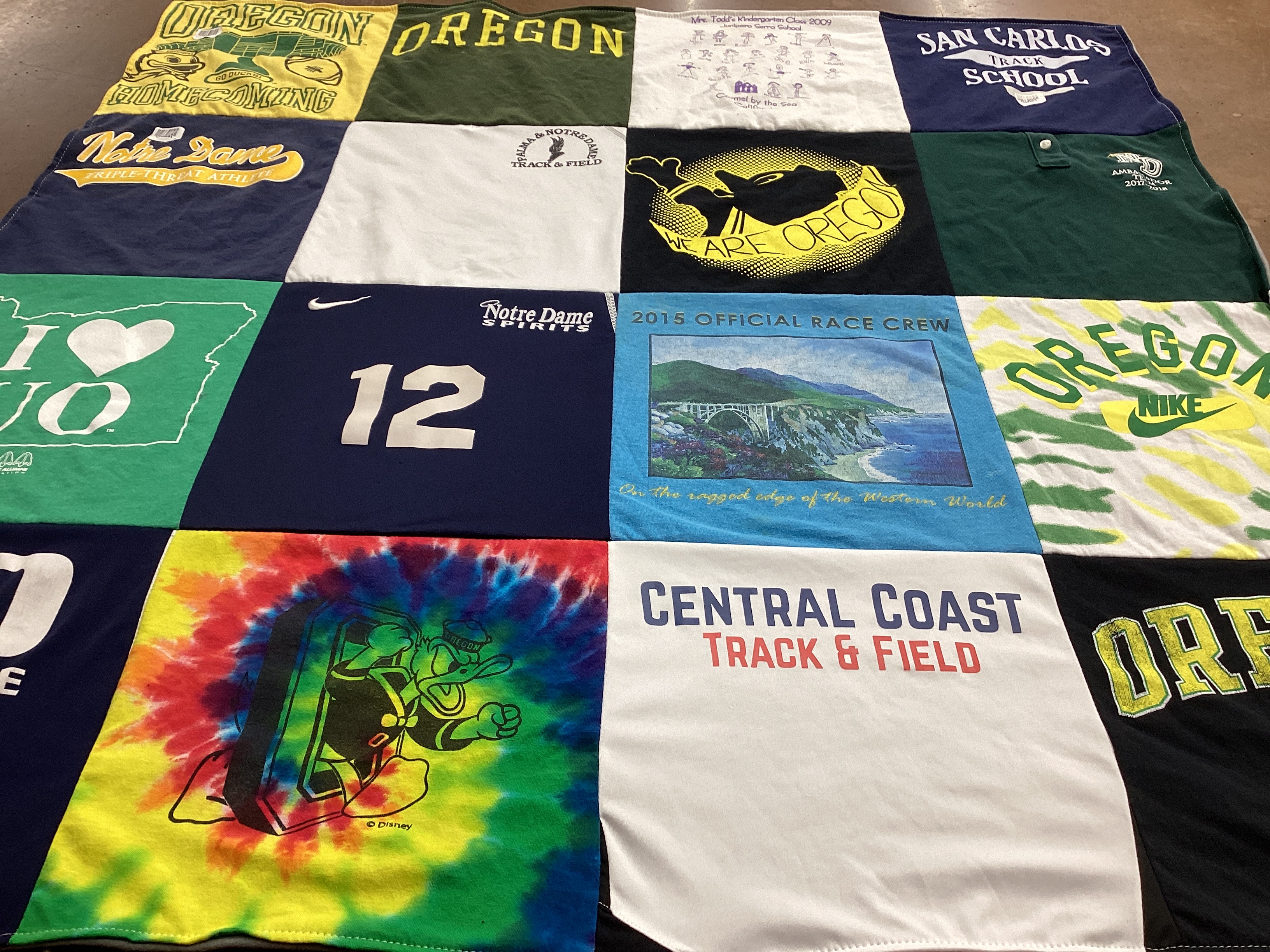 T-shirt quilt featuring oregon university track and field, central coast track and field by Theresa from CA