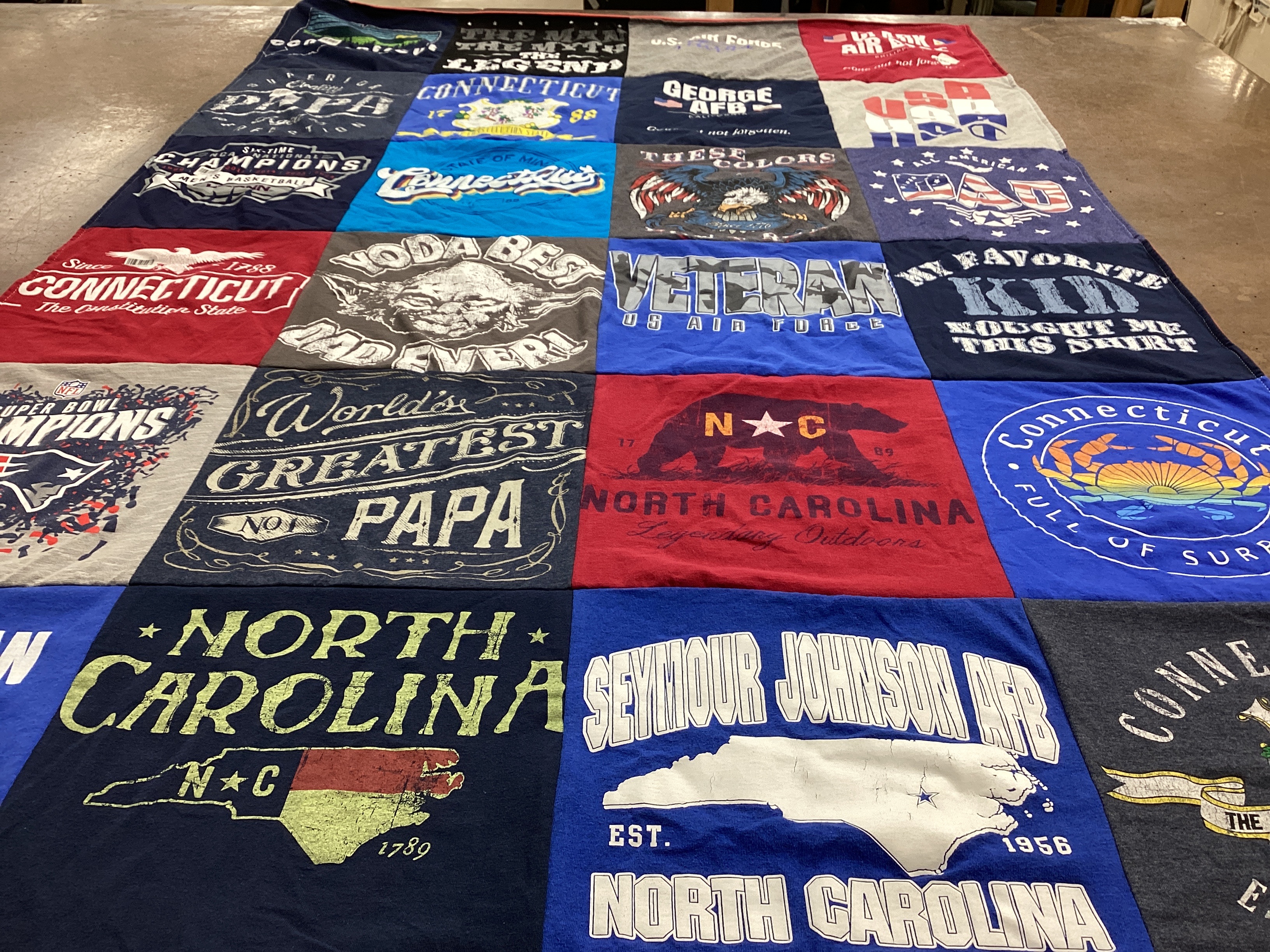 T-shirt quilt with veterans, sports themes by Brian from NC