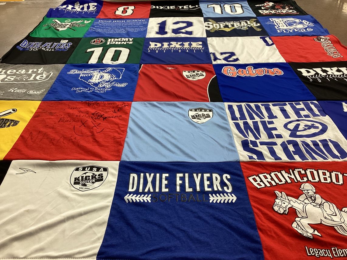 T-shirt quilt featuring dixie flyers softball, susa kicks soccer by Tasha from UT