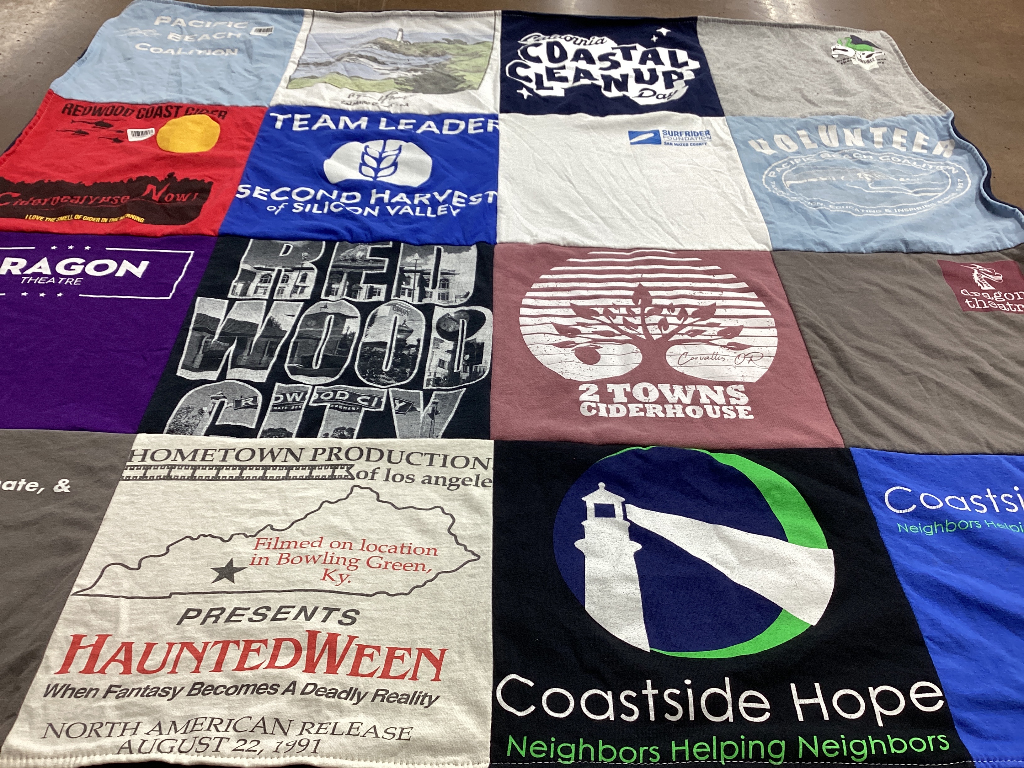 T-shirt quilt with community service, theater themes by Meredith  from CA
