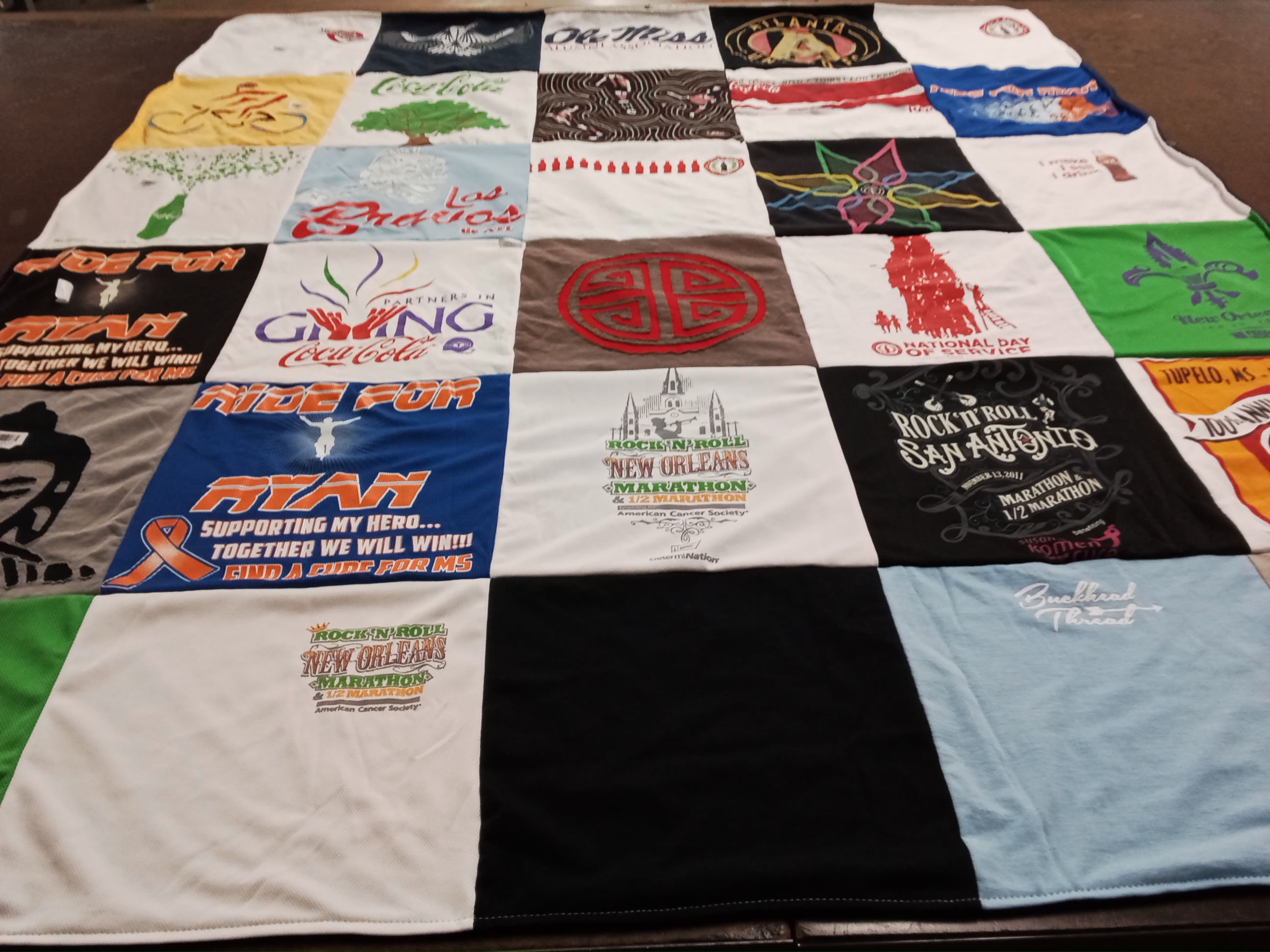 T-shirt quilt with marathons, fundraising themes by Mary Ellen from TX
