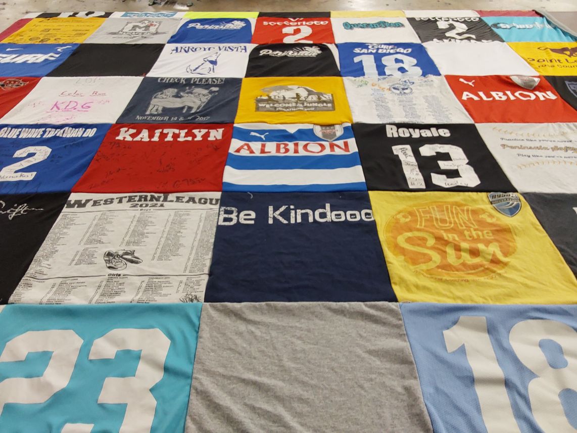 T-shirt quilt with sports, community themes by Shalom from CA