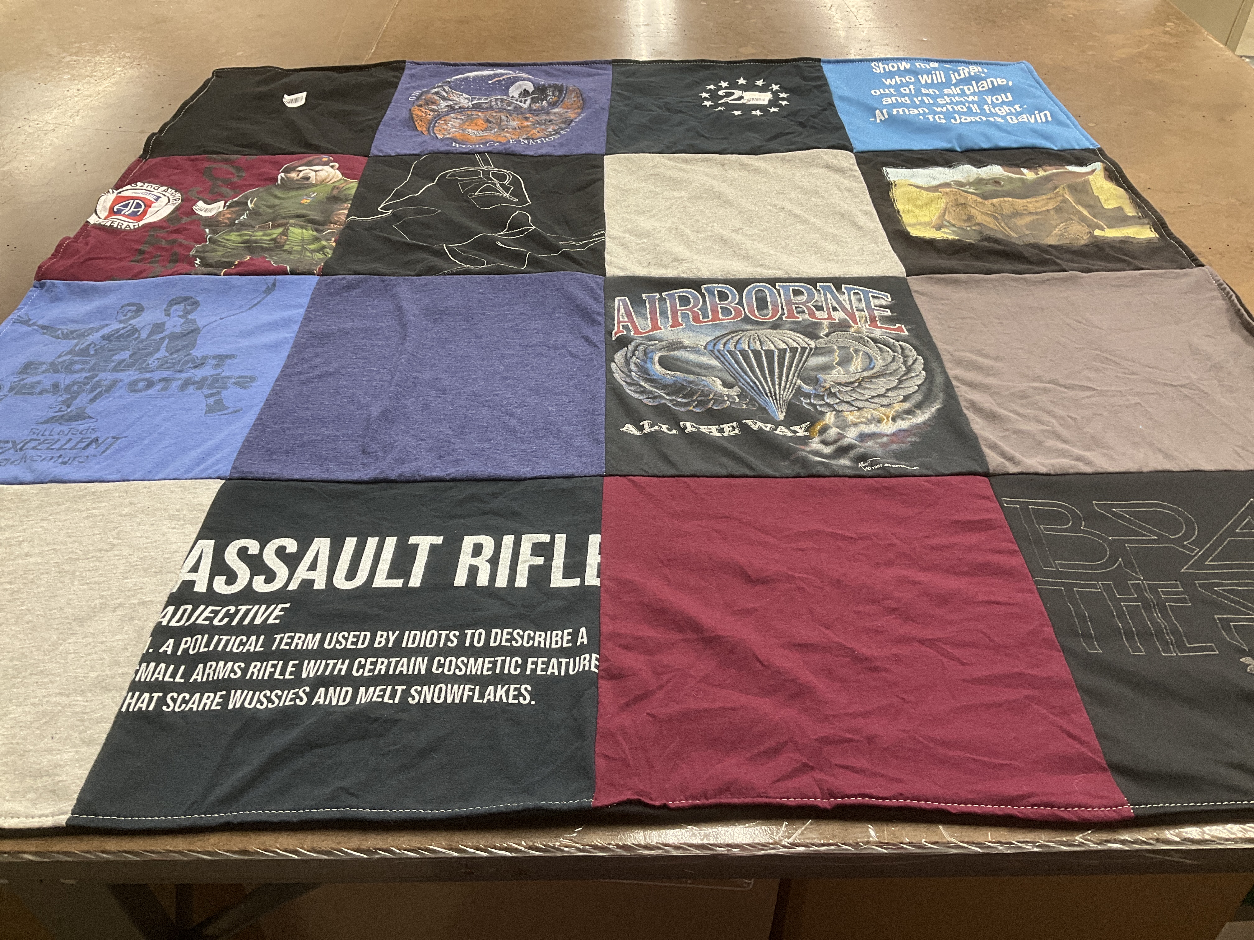 T-shirt quilt with military, firearms themes by Bobbie from MI