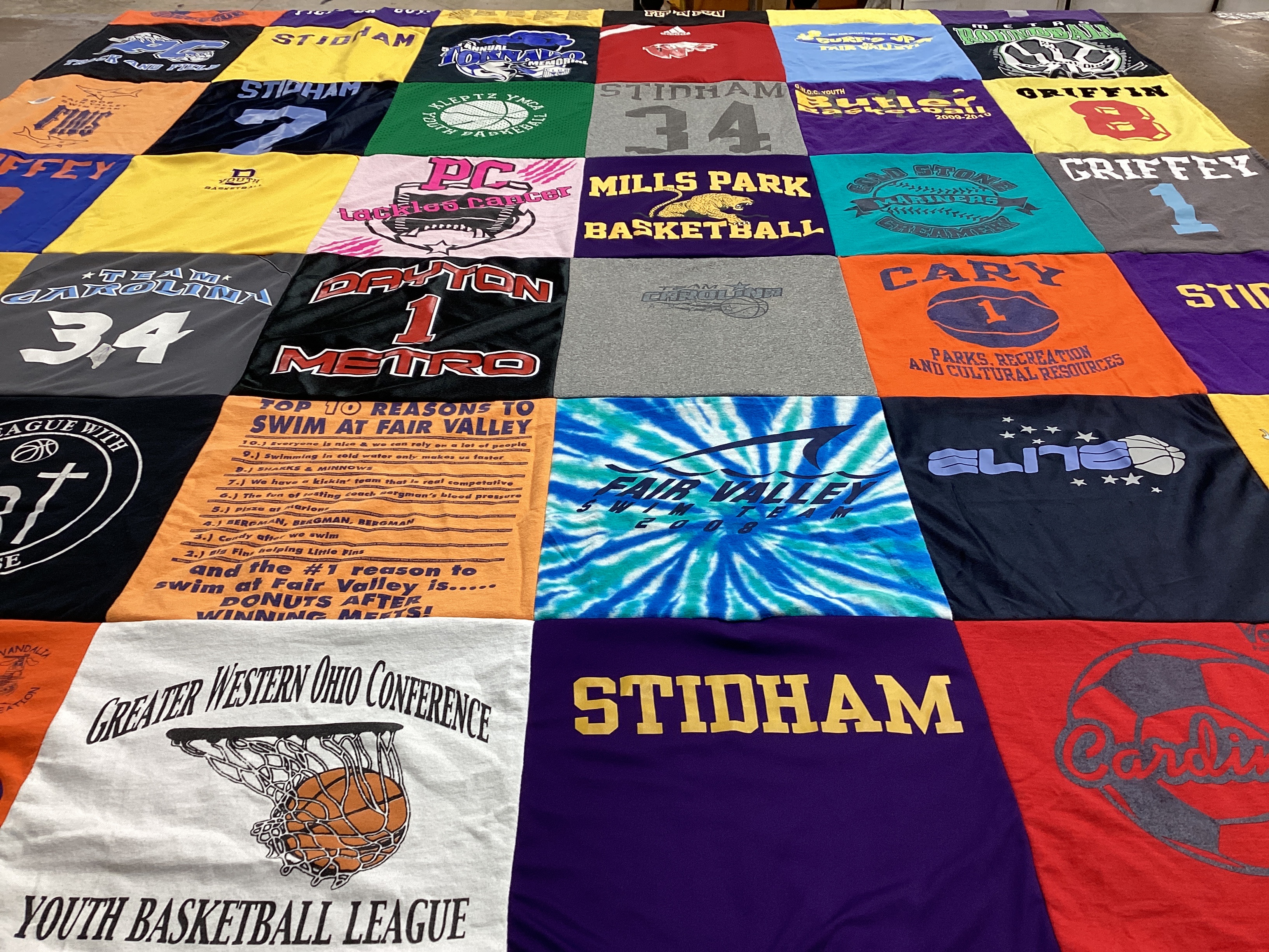 T-shirt quilt with basketball, swimming themes by Cheryl from NC