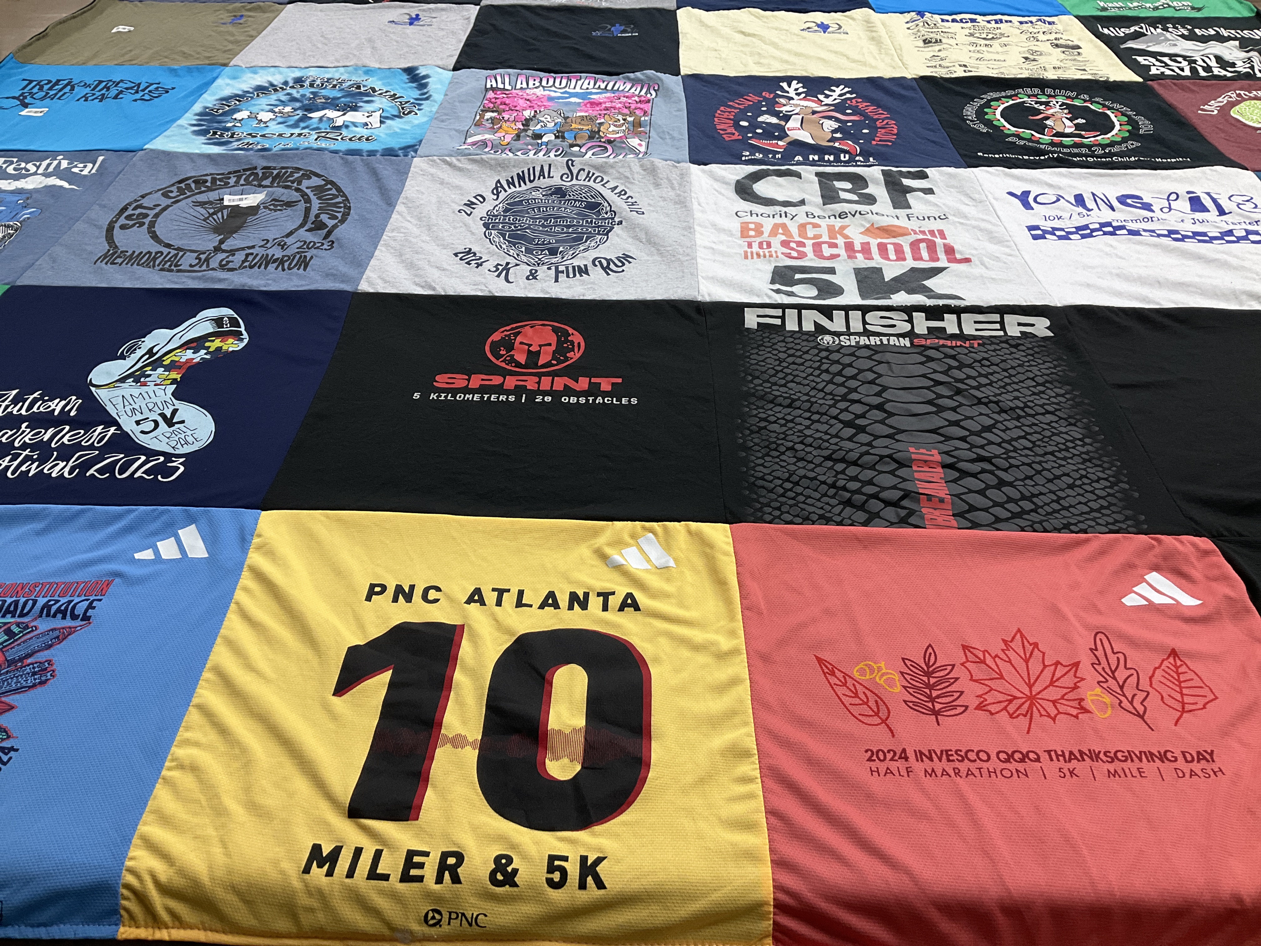 T-shirt quilt with running, charity events themes by Farrer from GA