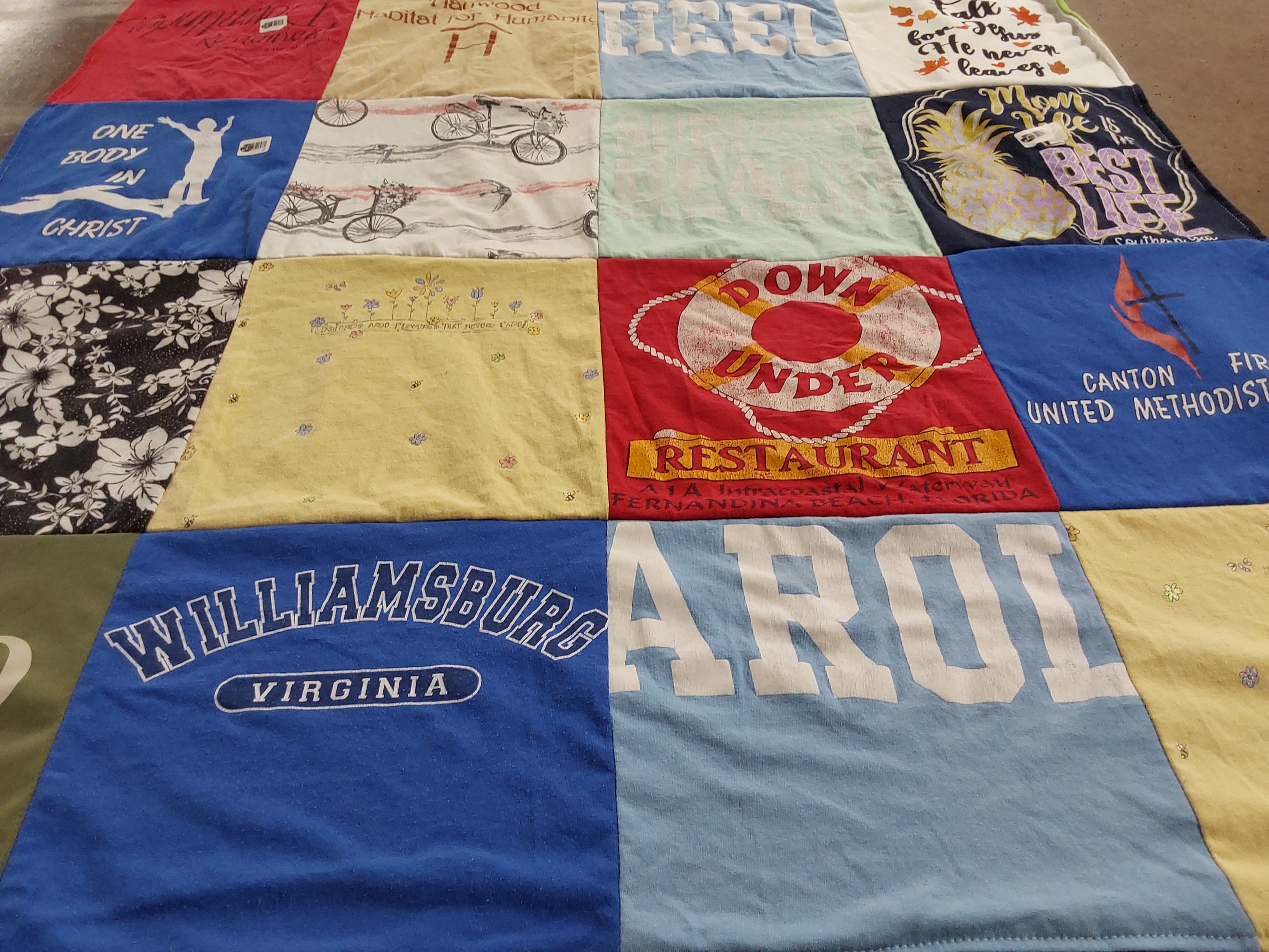 T-shirt quilt with decore, community service themes by Mary from OH