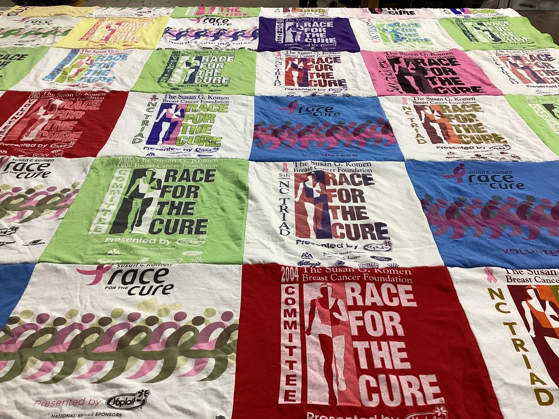 T-shirt quilt with breast cancer awareness, charity events themes by Amanda from NC