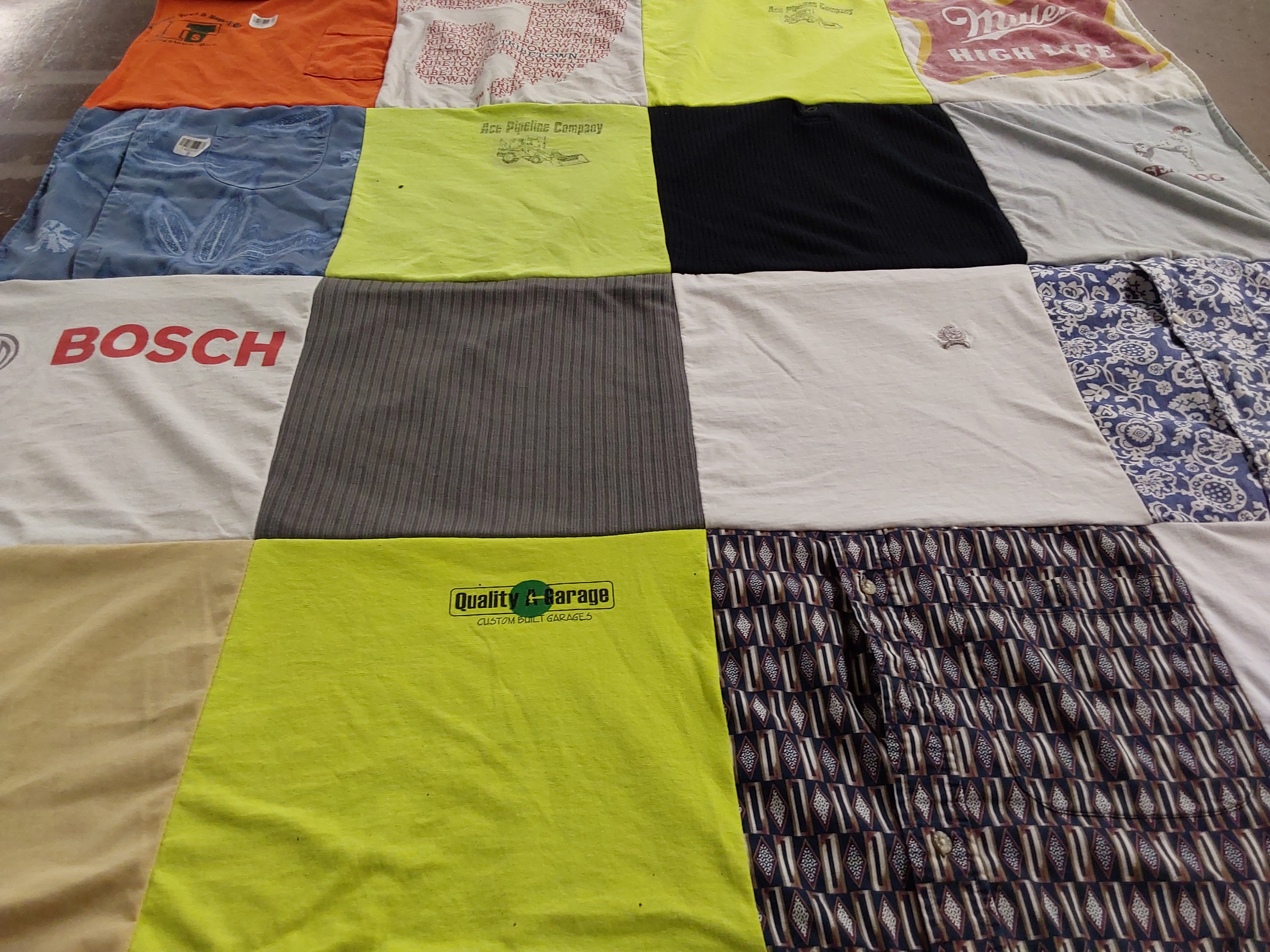 T-shirt quilt with pipelining, automotive themes by Carrie from OH