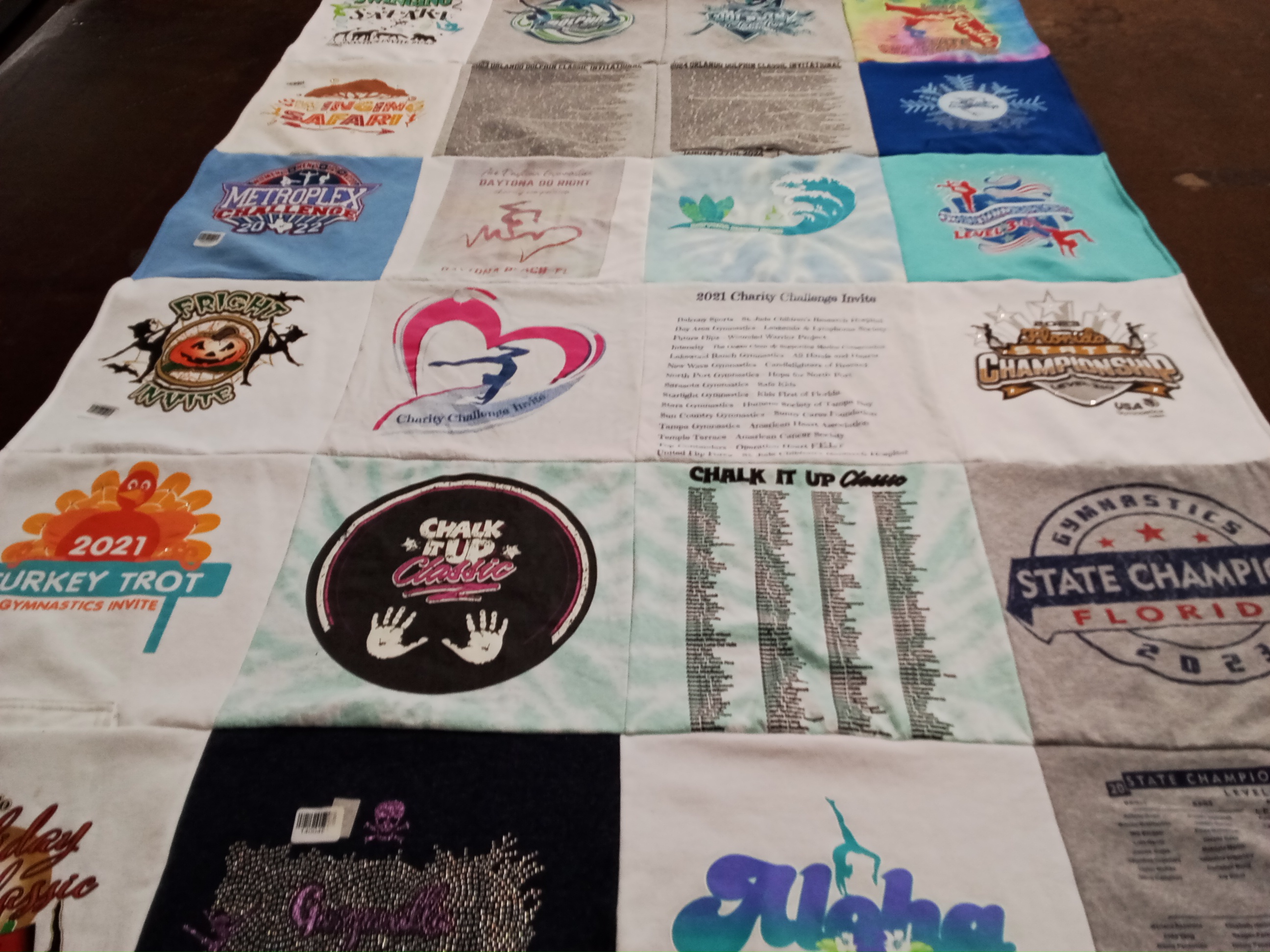 T-shirt quilt with gymnastics, charity events themes by Aimee from FL