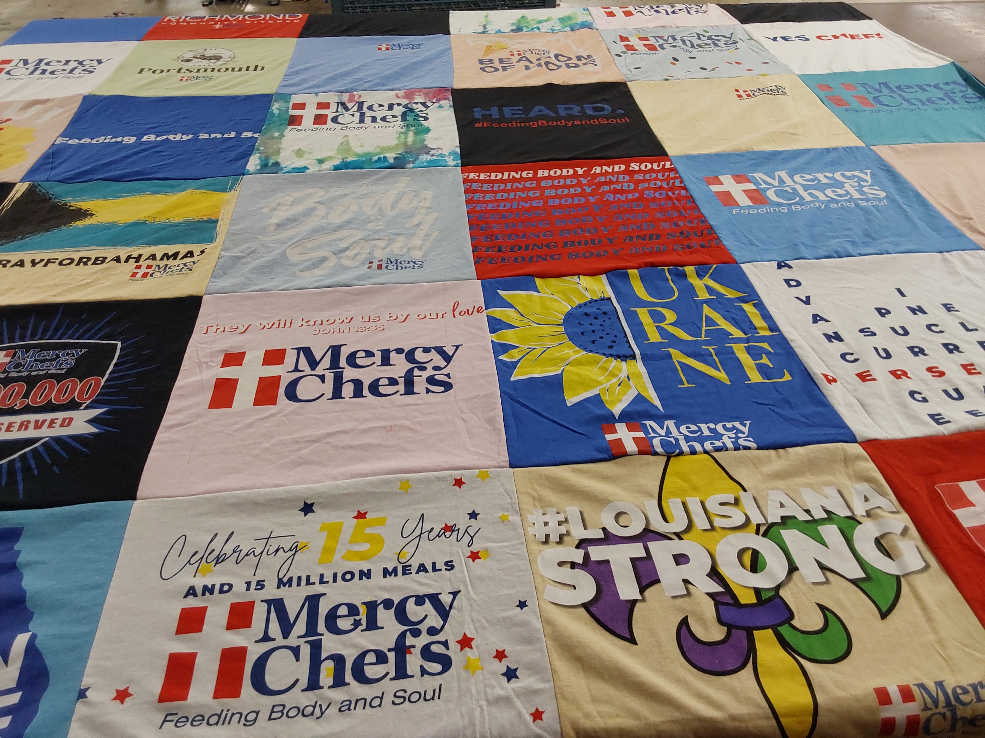 T-shirt quilt with cooking, charity themes by Stephanie from VA