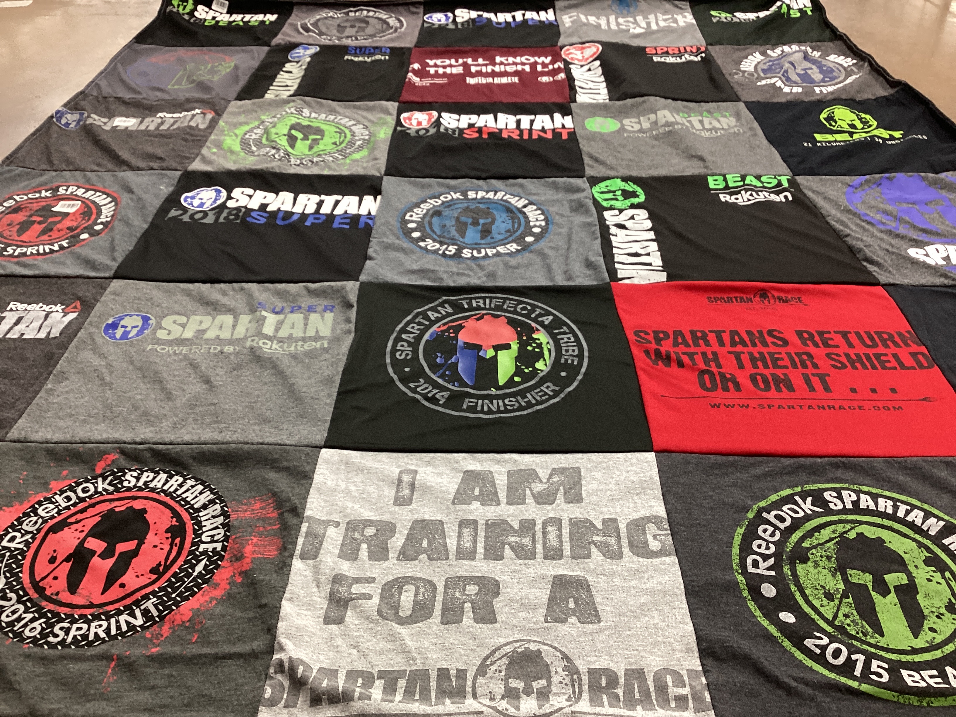 T-shirt quilt with obstacle racing, fitness themes by Stephanie from CT
