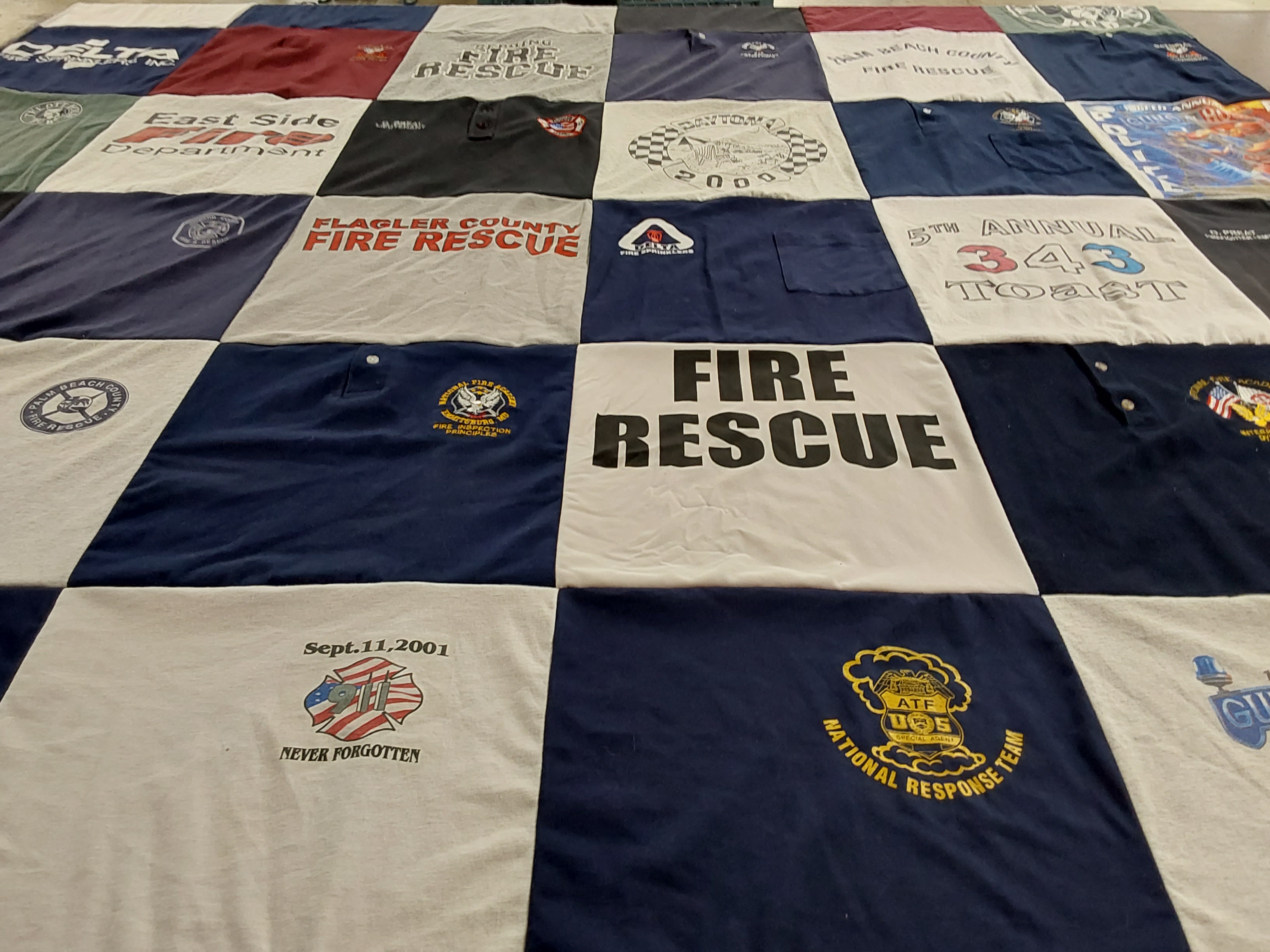 T-shirt quilt with firefighting, emergency services themes by Dave from FL