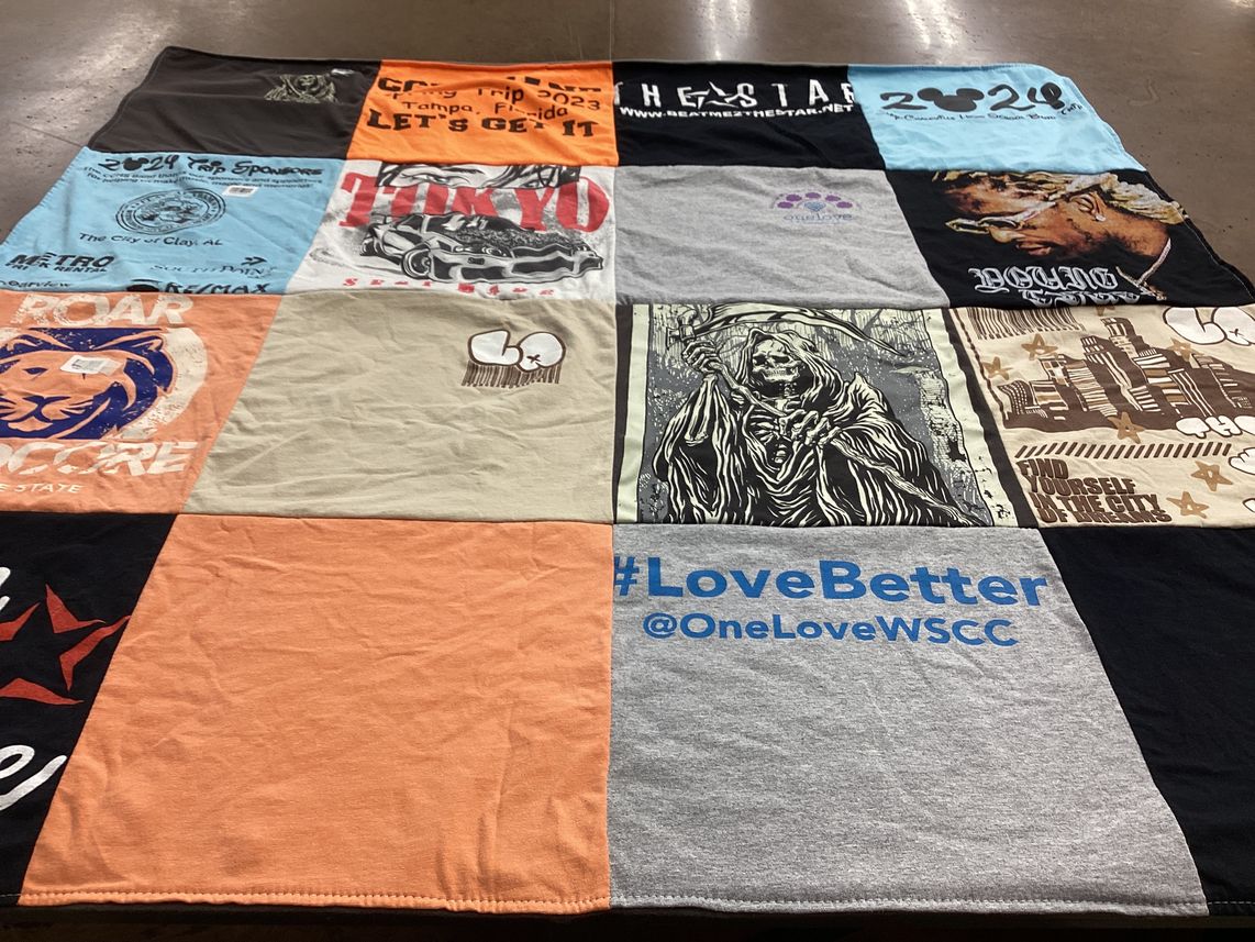 T-shirt quilt with travel, sports themes by Demica from AL