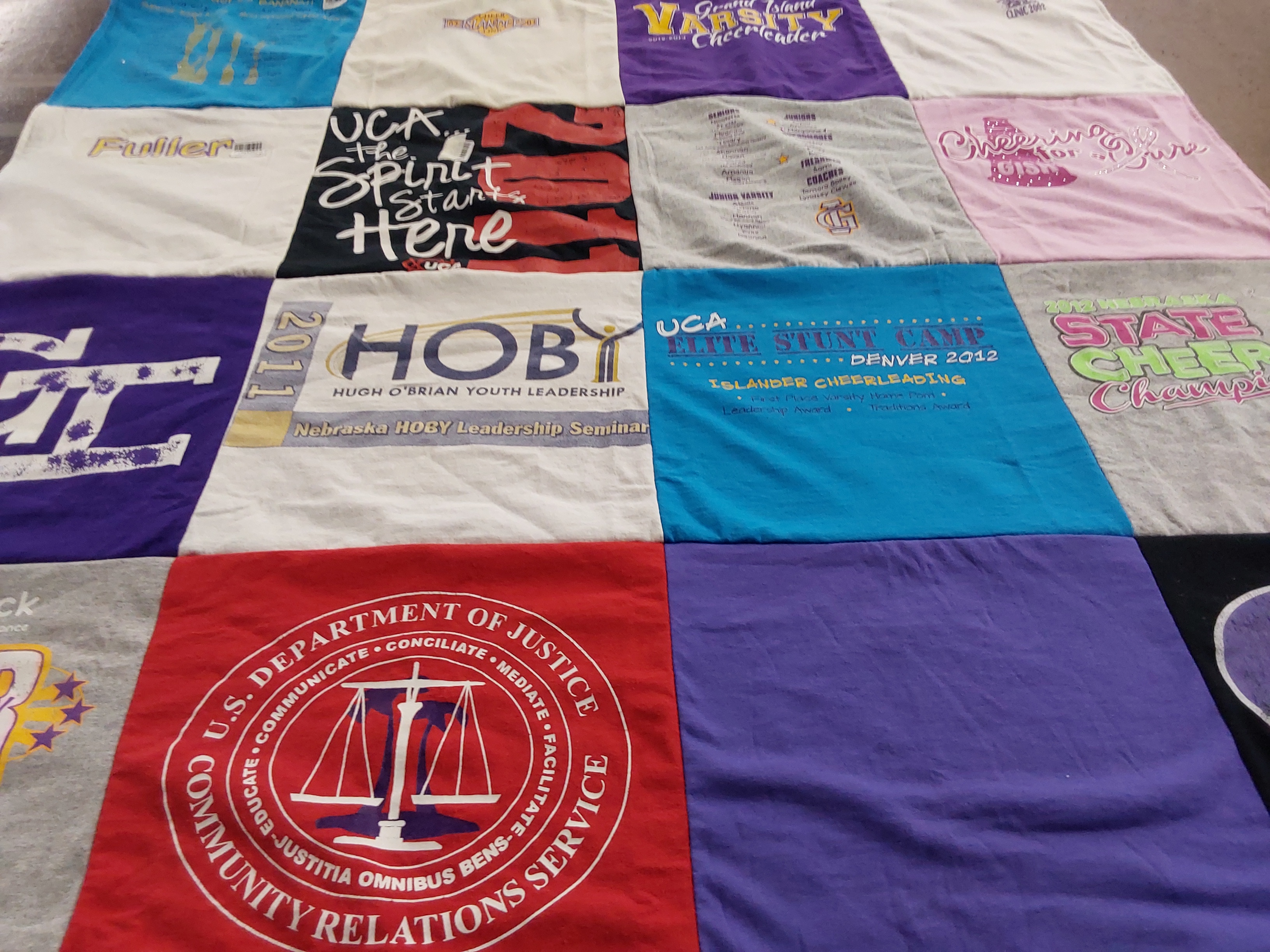 T-shirt quilt with cheerleading, leadership themes by Deena from NE