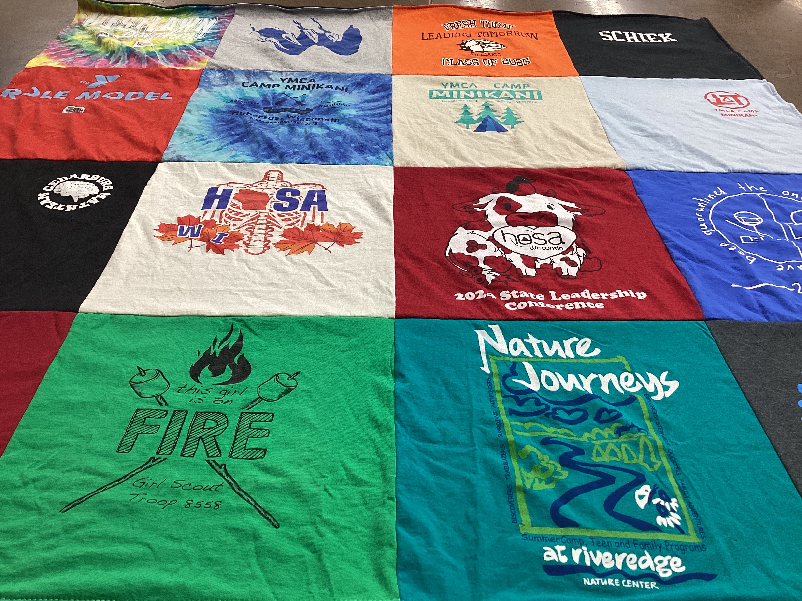 T-shirt quilt with outdoor activities, youth leadership themes by Clarissa from WI