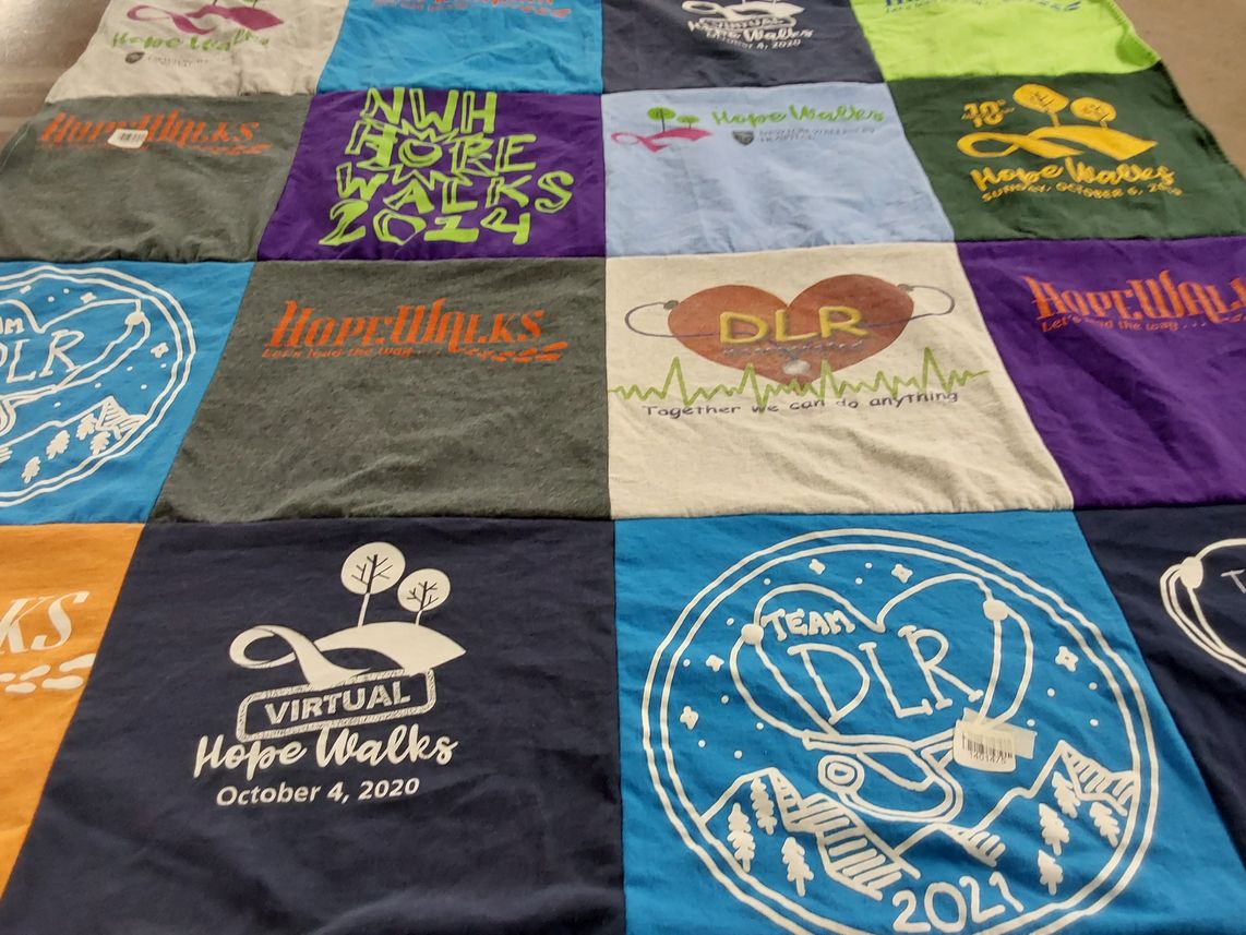 T-shirt quilt with walking, community events themes by Julia from MA