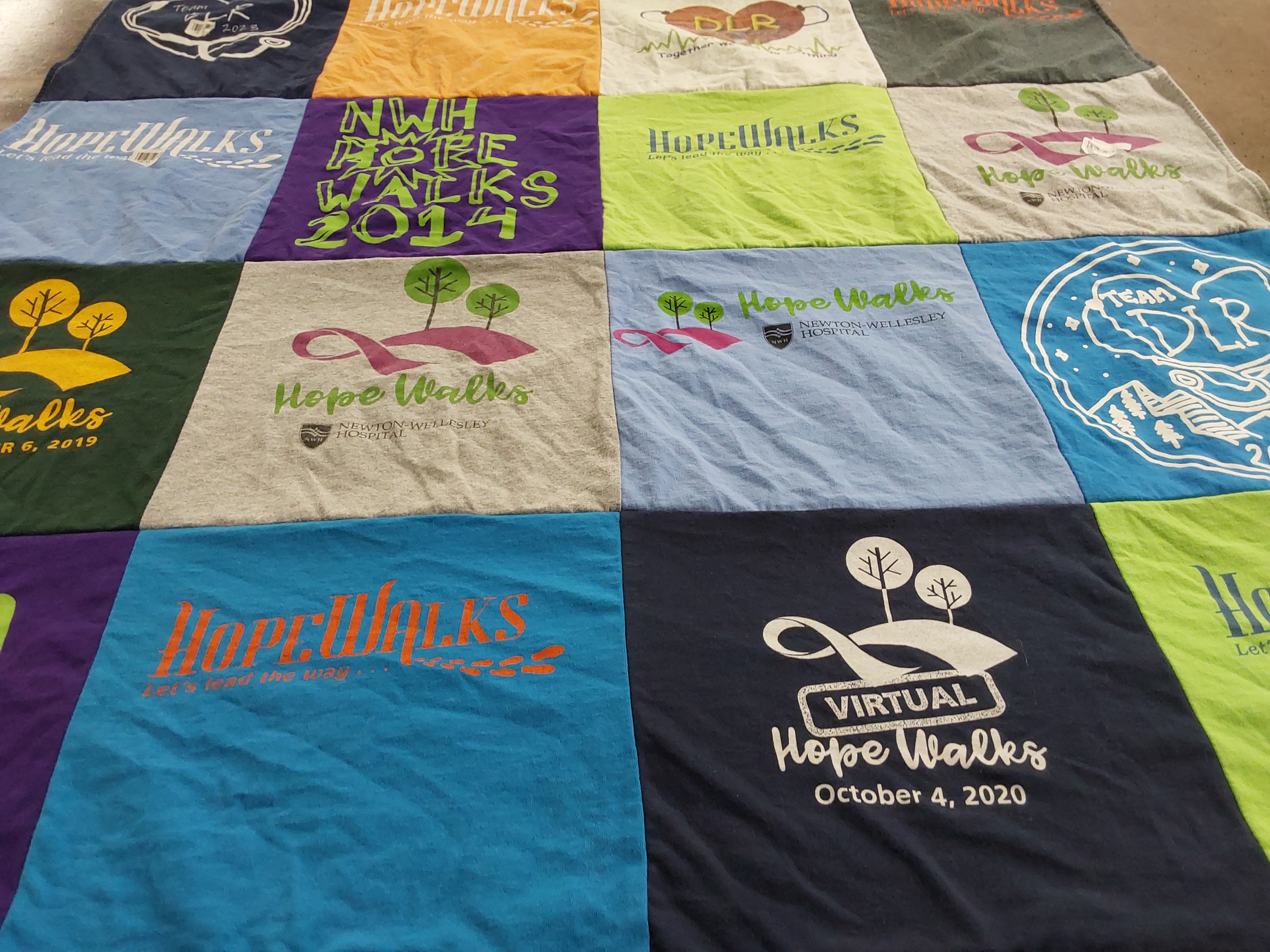 T-shirt quilt with walking, community events themes by Julia from MA