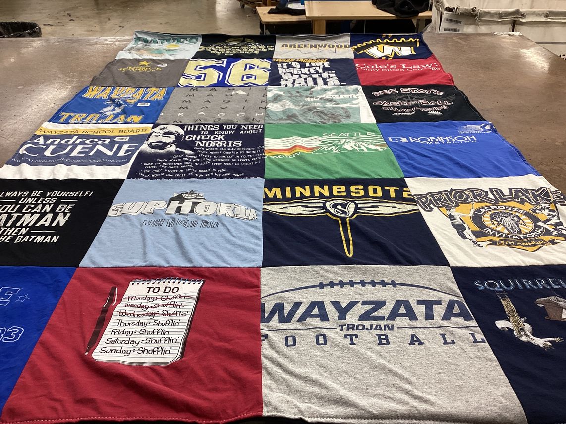 T-shirt quilt featuring wayzata trojan football, prior lake lacrosse by Andrea from MN