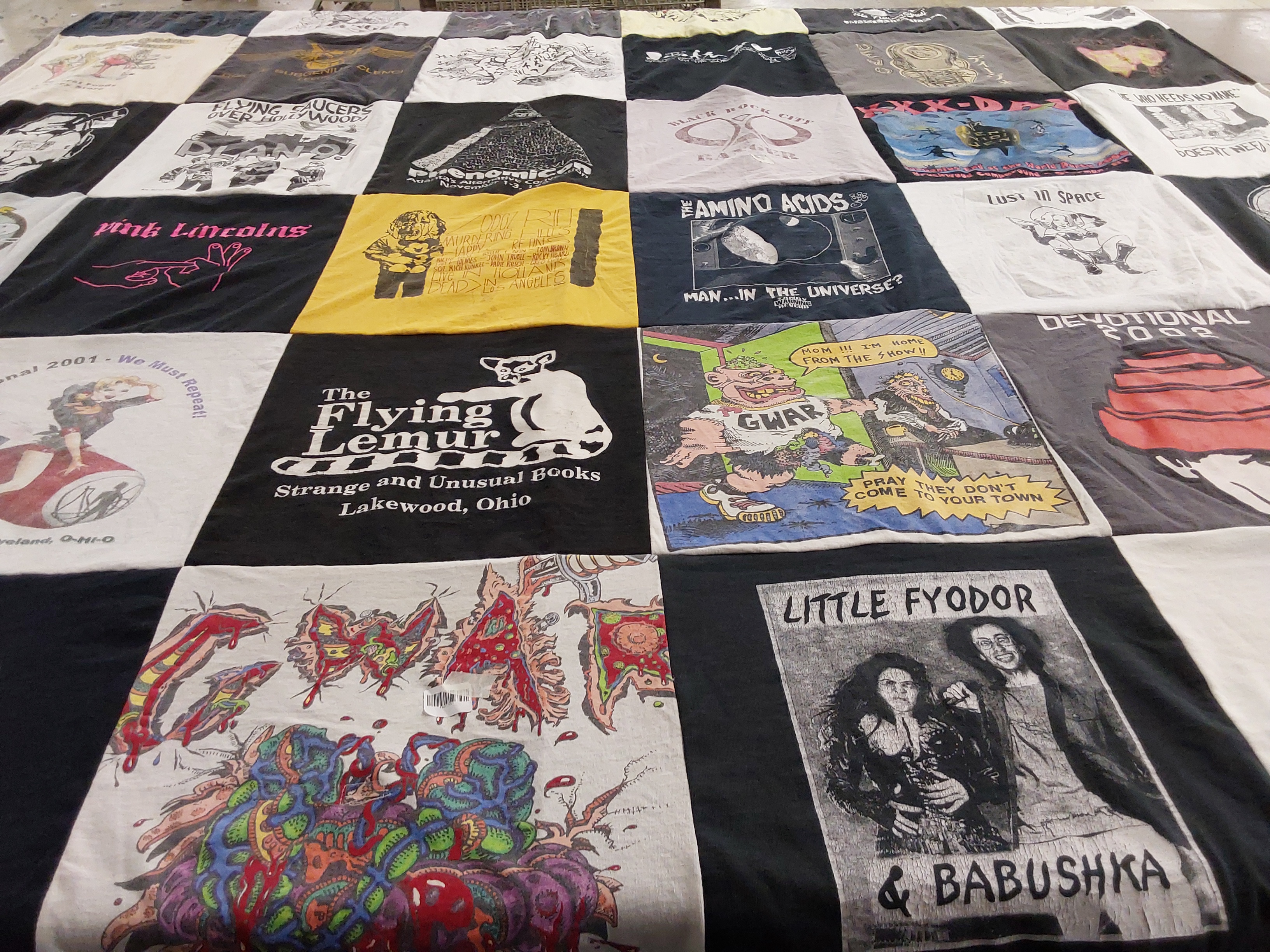 T-shirt quilt with books, music themes by Douglass from TX