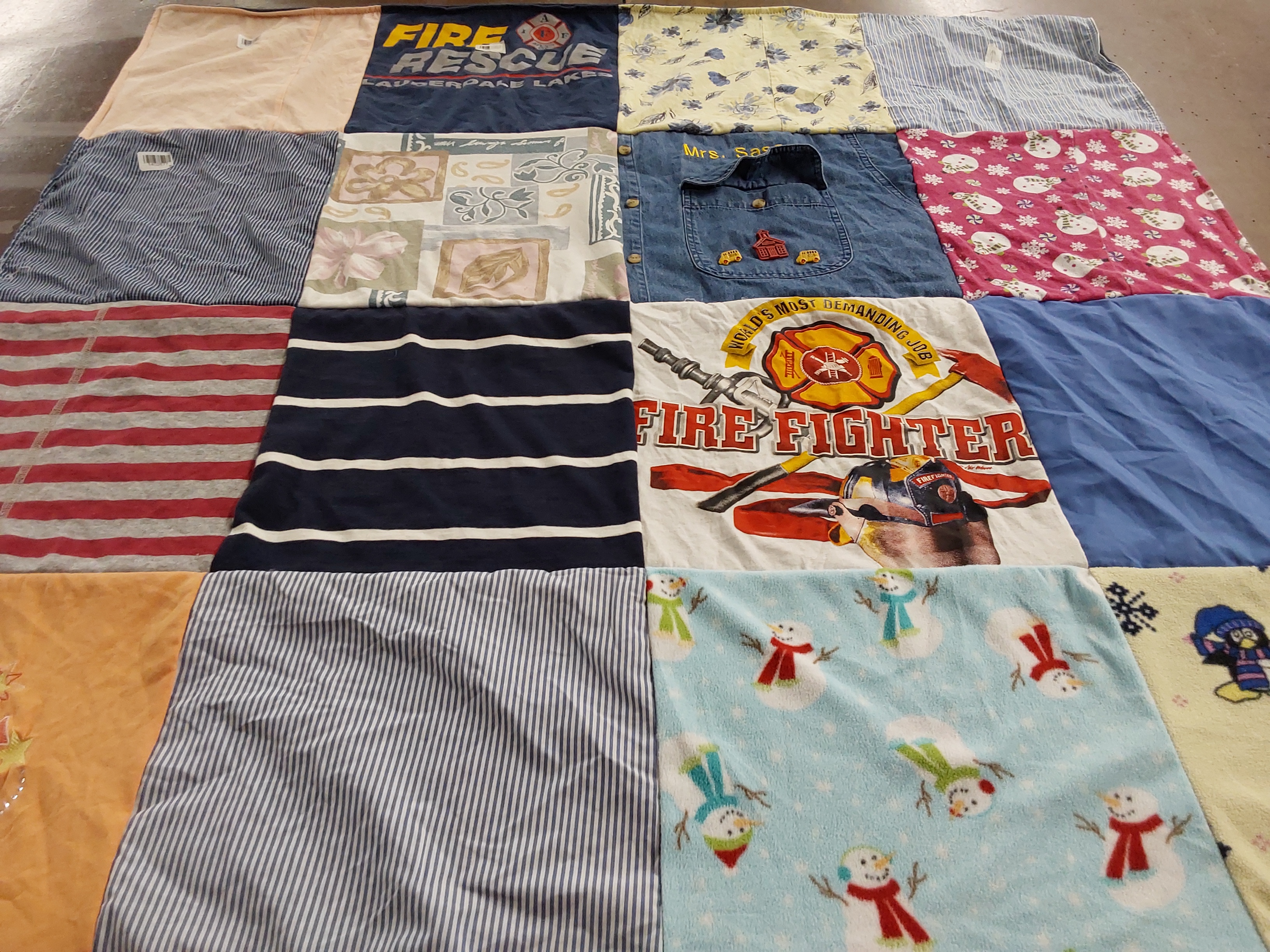 T-shirt quilt with firefighting, seasonal themes by Natalie from IN