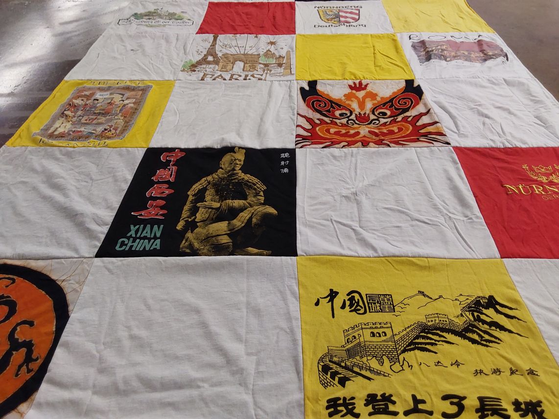 T-shirt quilt with traveling, culture themes by Sueva from CA