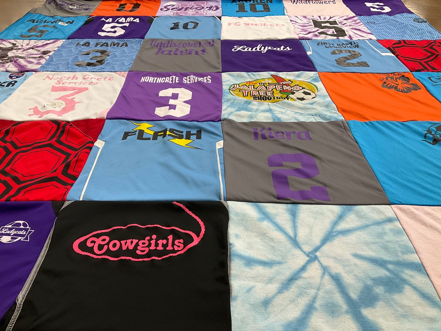T-shirt quilt with sports, team activities themes by Justine from TX